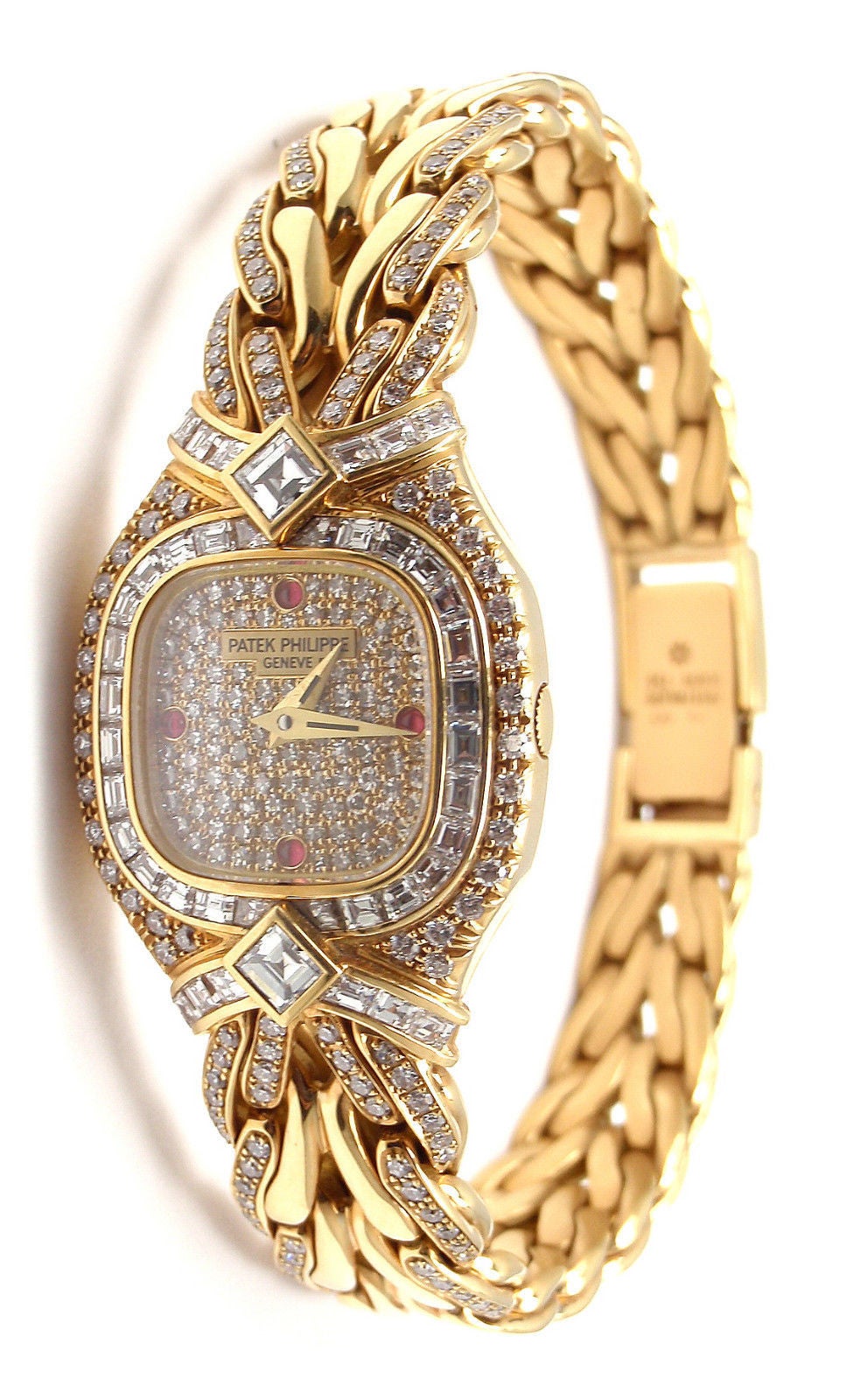 Patek Philippe Lady's 18k Yellow Gold, Diamond and Ruby La Flamme Bracelet Watch, Ref. 4808

This watch is unworn and comes with all the papers and a Patek Philippe box.

With 40 square-cut diamonds, total weight 1.40cts
Two square-cut diamonds