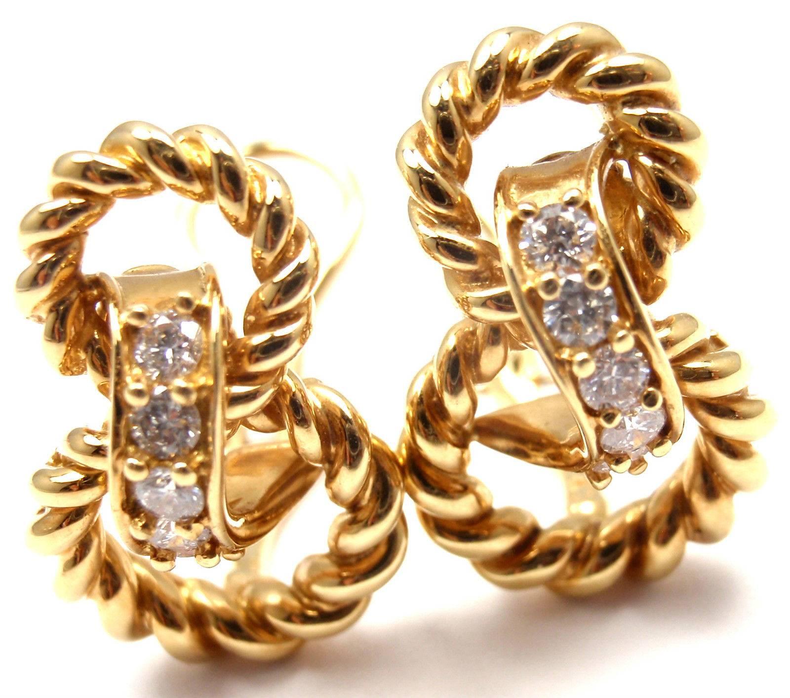 18k Yellow Gold Diamond Earrings by Tiffany & Co.
With 10 round brilliant cut diamonds VS1 clarity, G color total weight approx. .30ct

These earrings are made for non pierced ears, but they could be easily converted.

Details:
Weight: 10.4