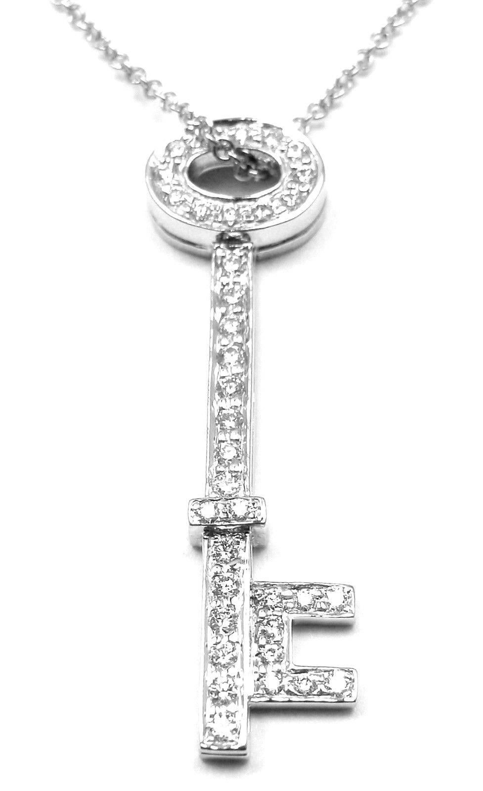 Platinum Oval Key Pendant Necklace by Tiffany & Co.
With 36 round brilliant cut diamonds VS1 clarity, G color total weight approx. .34ct

Details:
Measurements: Pendant: 1 1/4