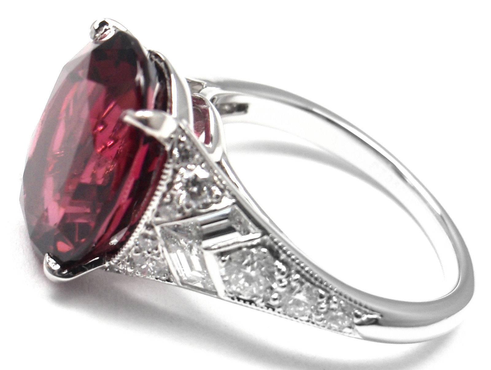 Platinum 6.07ct Rubellite & Diamond Ring by Tiffany & Co.
With 1 large oval rubellite 6.07ct
18 round brilliant cut diamonds VS1 clarity, G color and 4 baguette diamonds VS1 clarity, G color total weight approx. 1ct

This ring comes with Tiffany