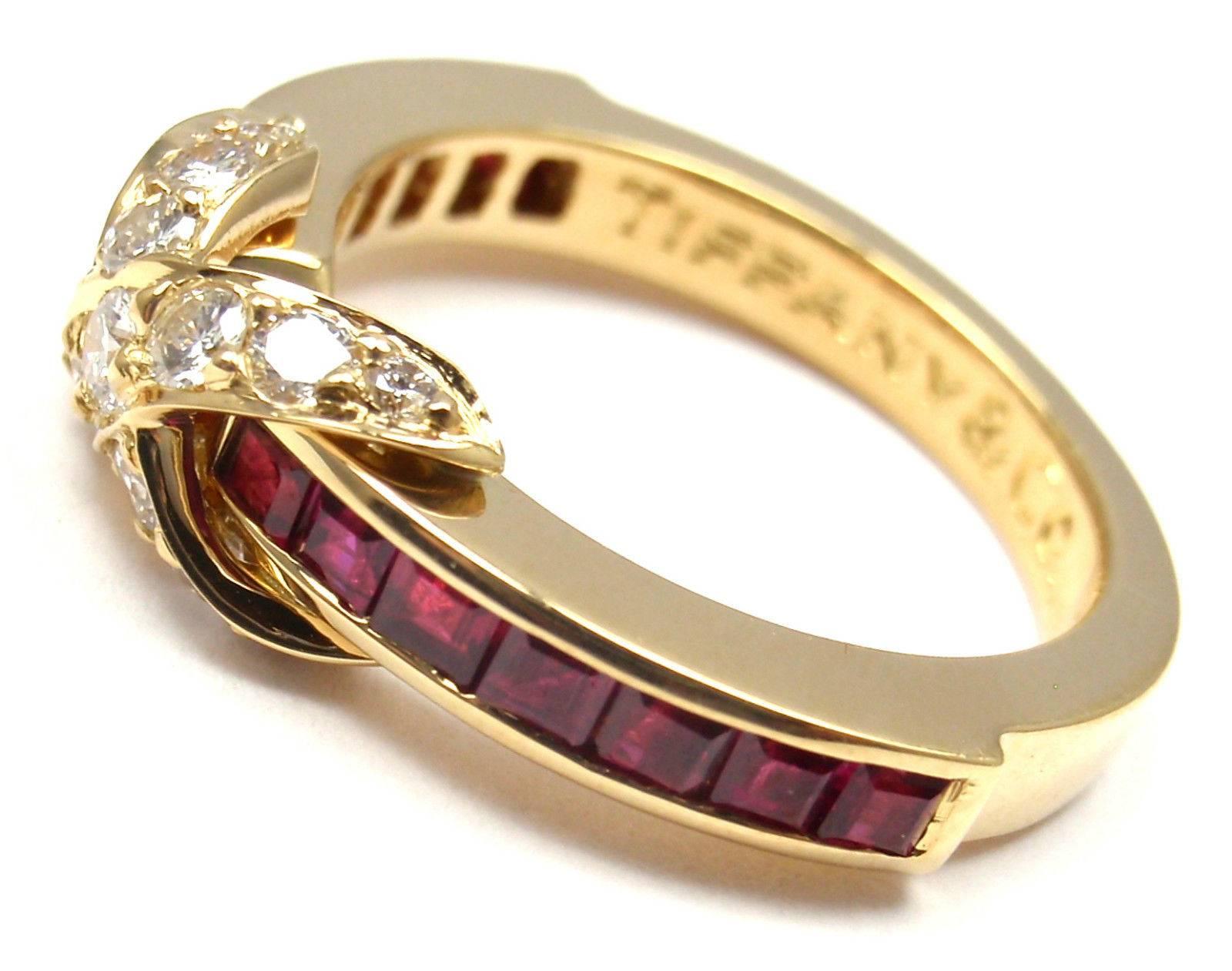 18k Yellow Gold Diamond X Ruby Ring by Tiffany & Co.
With 14 round shape diamonds VS1 clarity G color
total weight approx. .28ct and 14 rubies.

Details: 
Ring Size: 4 3/4, can be resized.
Weight: 4.7 grams
Width: 6mm
Stamped Hallmarks: