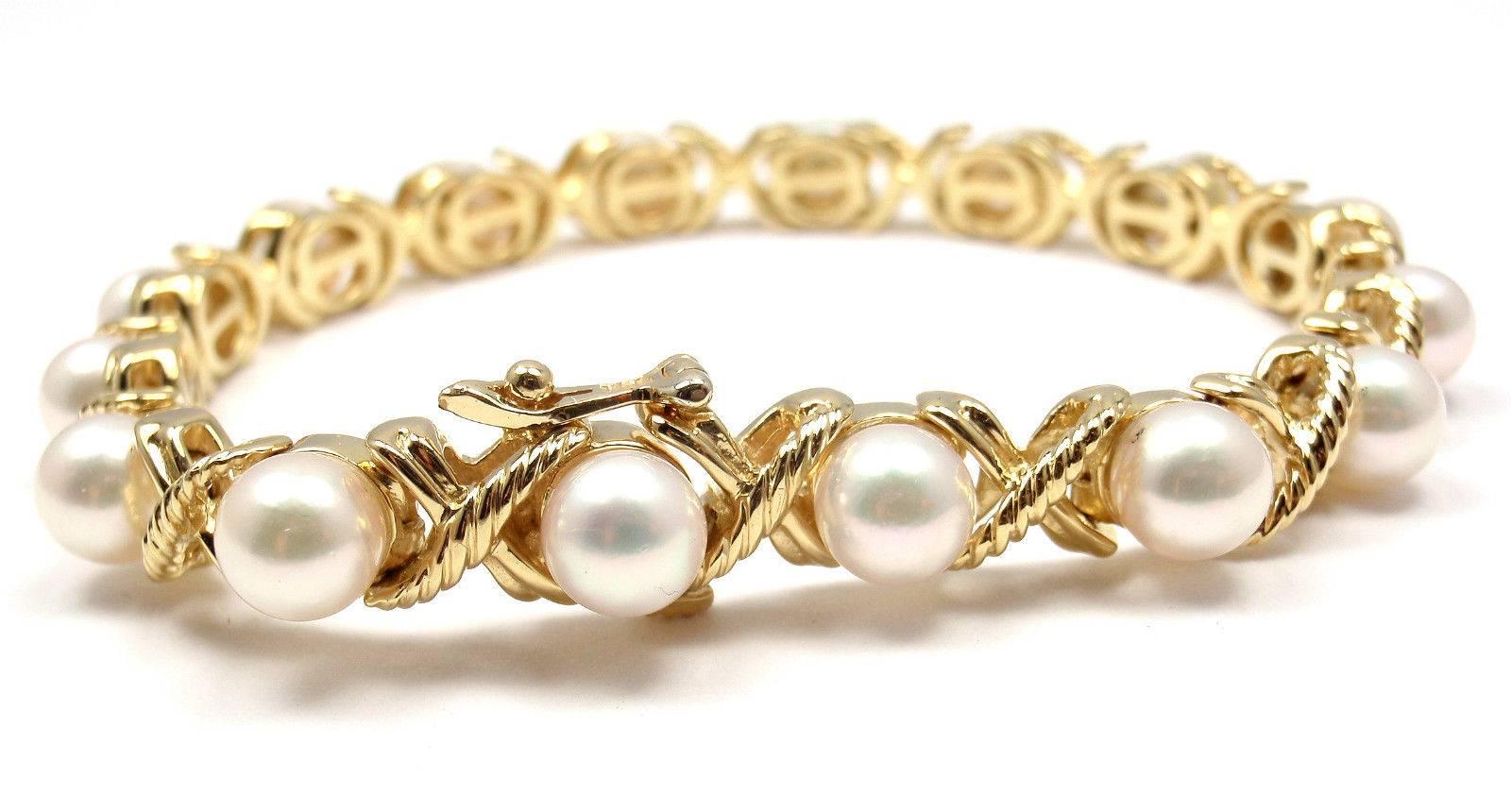 18k Yellow Gold Pearl X Bracelet by Tiffany & Co. 
With 16 round akoya pearls approx. 7mm each

Details: 
Length: 7