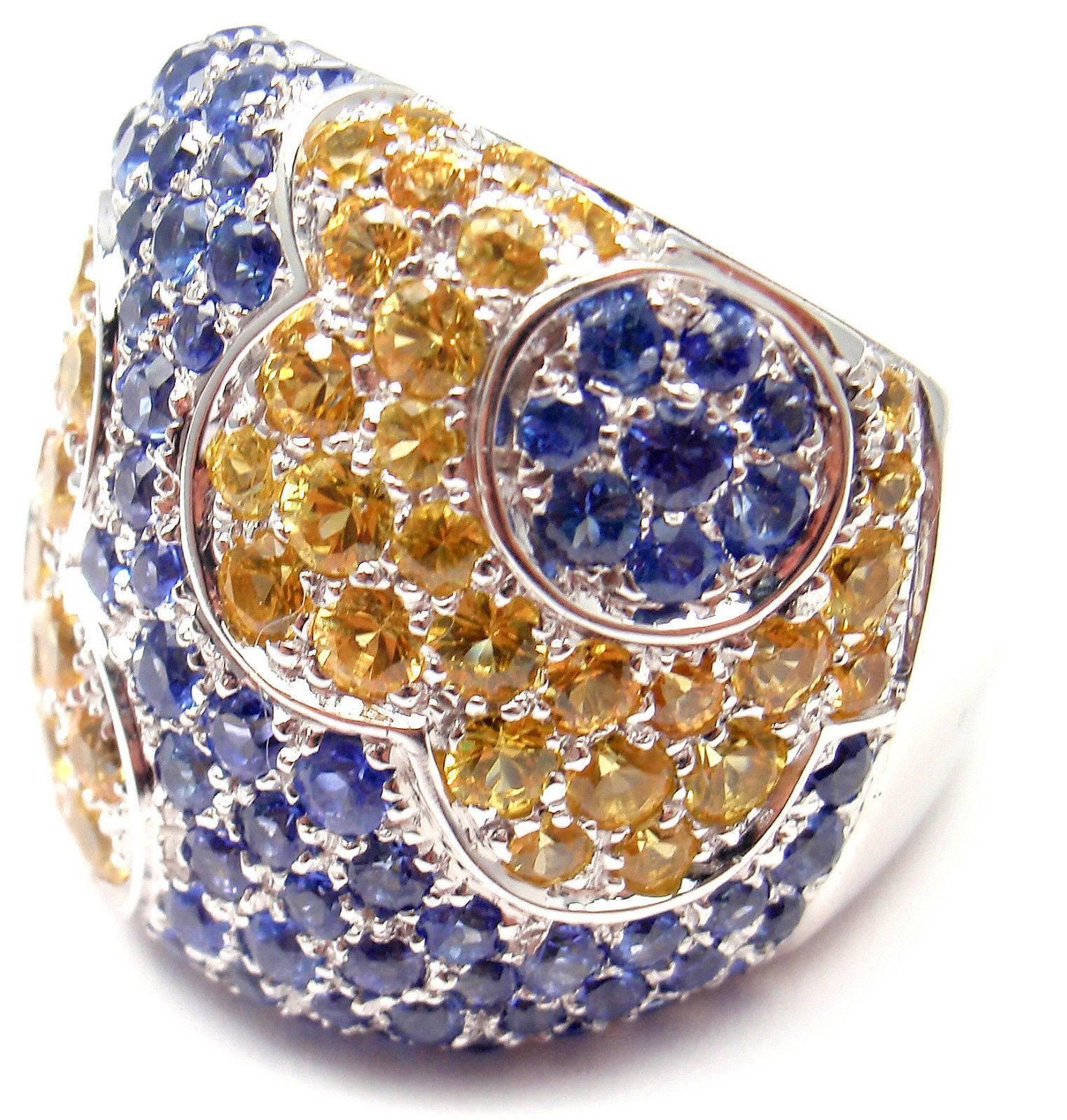 18k White Gold Sapphire COLOURS Petals Ring by Pasquale Bruni. 
With Blue & Yellow Sapphires total weigh approx. 5.97ct

This ring comes with Box, Certificate and Tag.   

Details: 
Size: 7 
Weight: 22.1 grams 
Width: 23.5mm 
Stamped