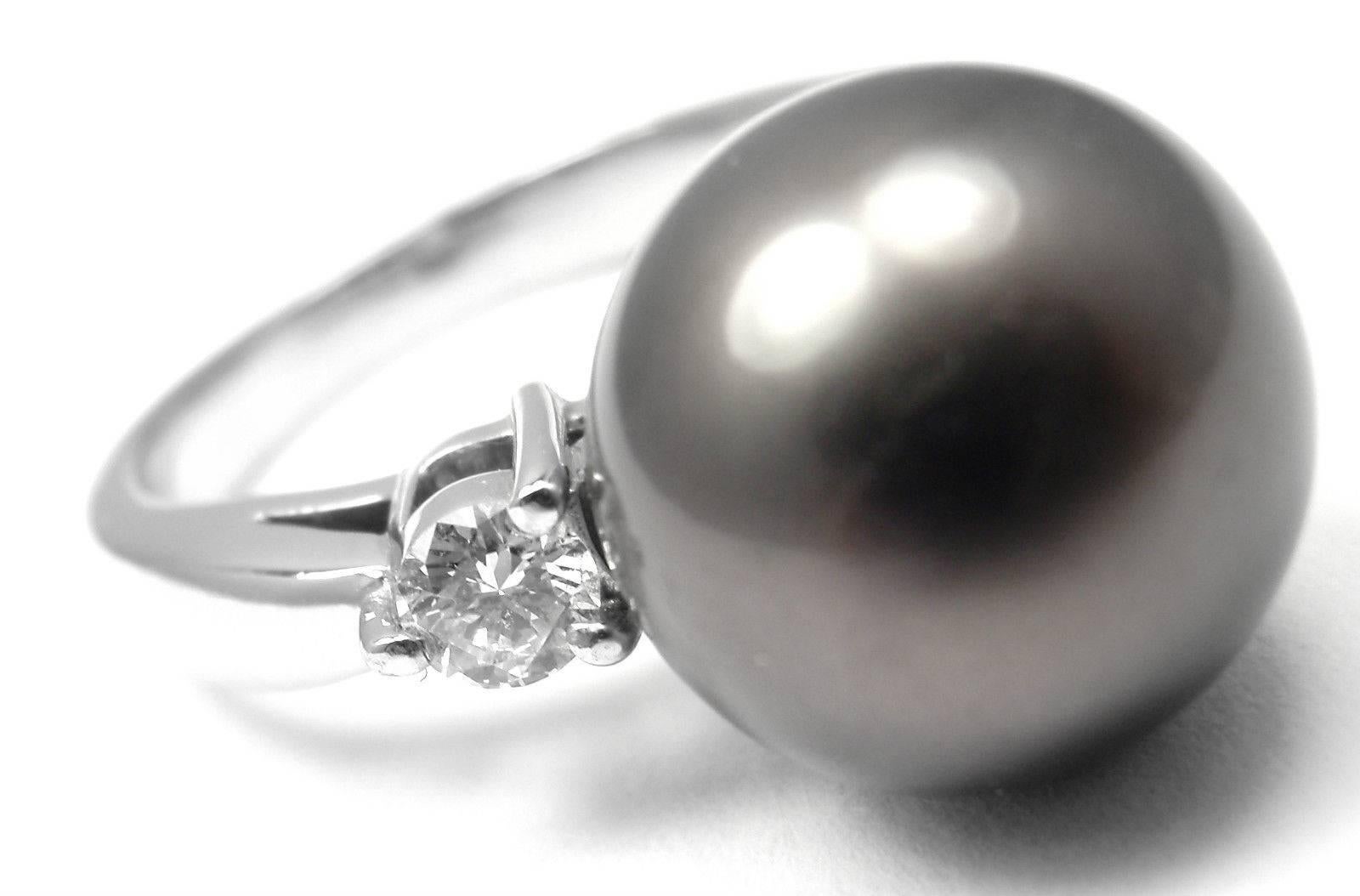 Platinum Diamond Large 11.5mm Tahitian Pearl Ring by Mikimoto. 
With 2x round brilliant cut diamonds VS1 clarity, G color total weight 
approx. 0.28ct and one 11.5mm high luster tahitian pearl 

Details: 
Ring Size: 5.5, Resize
