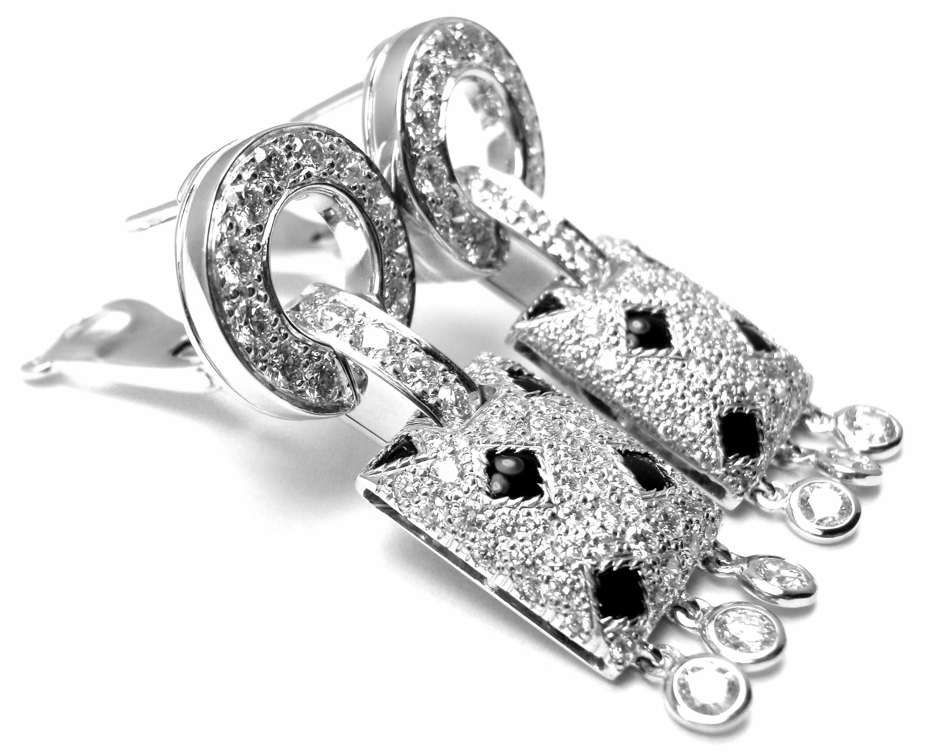 18k White Gold Panthere Diamond And Black Onyx Earrings by Cartier. 
With Round brilliant cut diamonds total weight approx .98ct.
Diamonds VVS1 clarity, E color and black onyx
These earrings come with original Cartier box and a Cartier