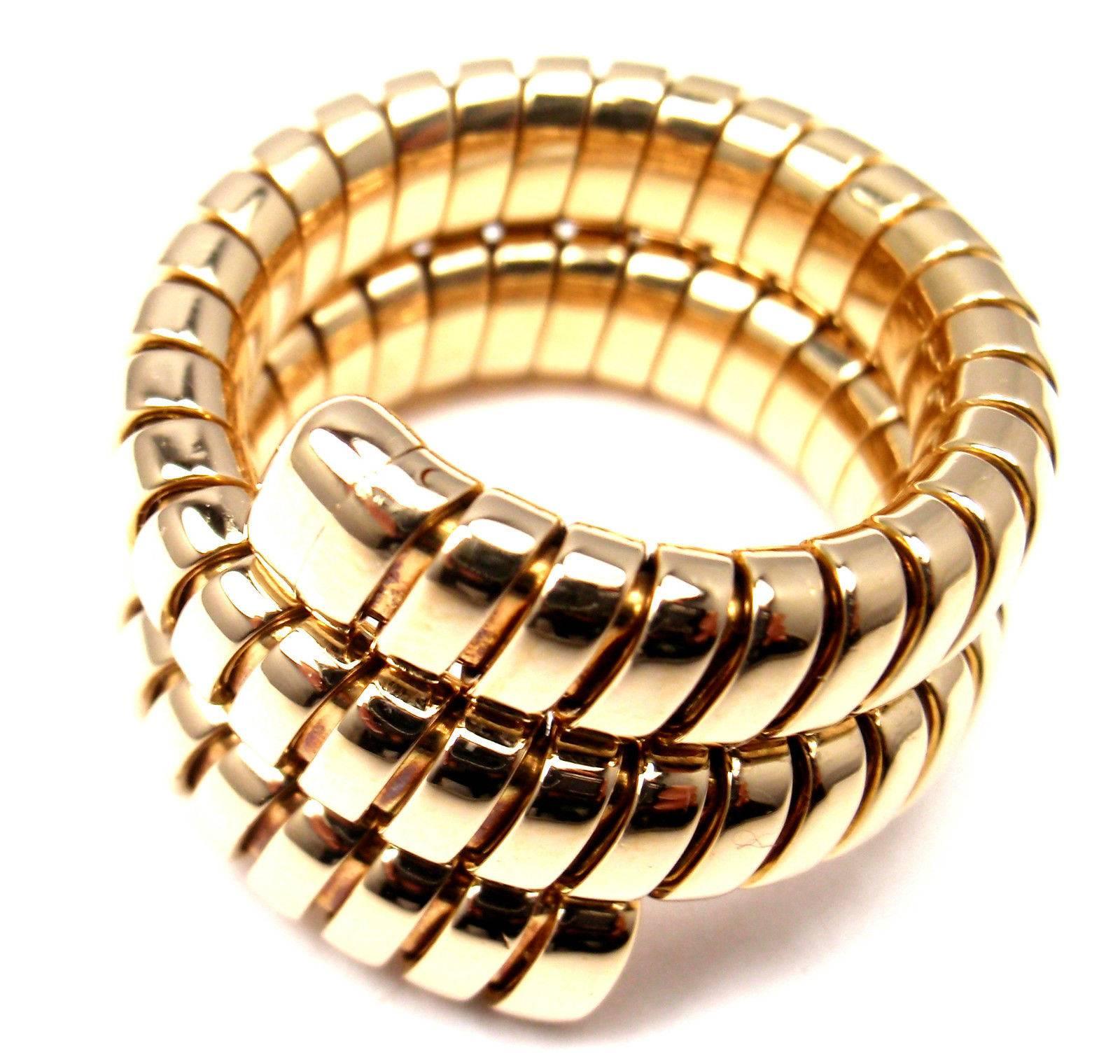 18k Yellow Gold Wrap Tubogas Snake ring by Bulgari.
This ring comes with an original Bulgari box.

Details:
Size: 6-8 (Flexible)
Weight:16.9 grams
Width: 15mm
Stamped Hallmarks:  Bulgari, 750, 2337AL
*Free Shipping within the United