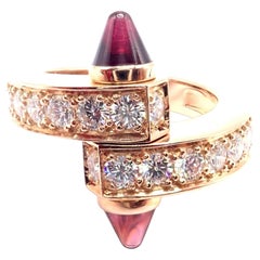 Bague Cartier « Menotte » en or rose, sertie de diamants et de rhodolite