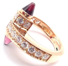 Bague Cartier « Menotte » en or rose, sertie de diamants et de rhodolite