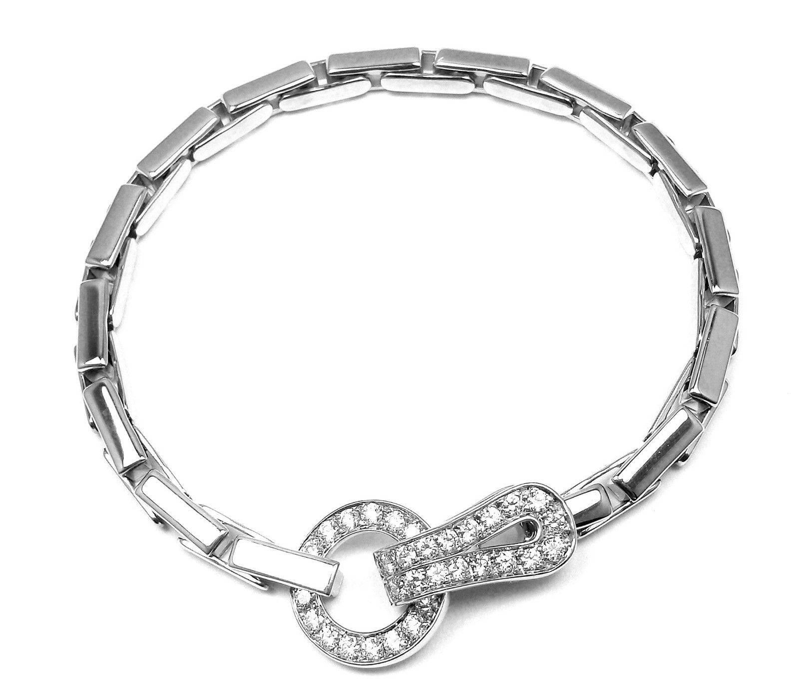 18k White Gold Diamond Agrafe Bracelet by Cartier.
With 35 round brilliant cut diamonds G color, VVS1 clarity total weight approx. 1.25ct
This bracelet comes with Cartier box.

Details:
Length: 7 1/4