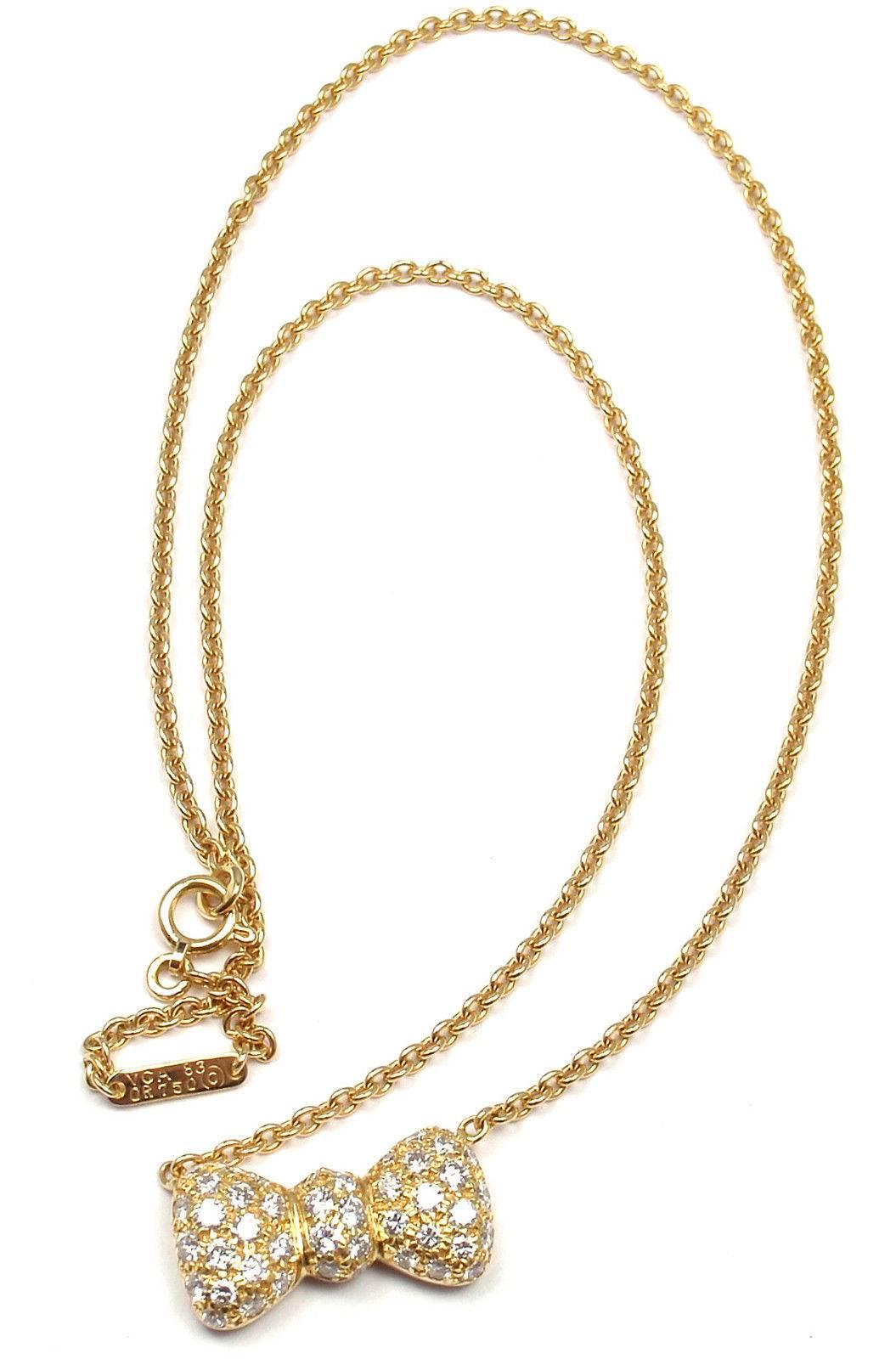 18k Yellow Gold Diamond Bow Pendant Necklace by Van Cleef & Arpels.
With 35 diamond VS1 clarity, E color total weight .89ct 
This necklace comes with VCA paper.
Details:
Length: 15.5