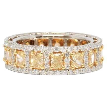 This natural yellow and diamond eternity band is a stunner! The band features 15 yellow radiant diamonds weighing 2.87 ct and 139 diamonds weighing 1.30 ct set in platinum, a definite must have for any fashionista.  