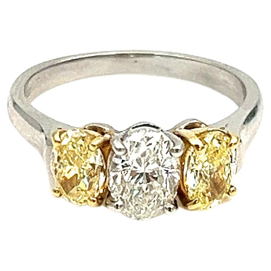 2.21 Carat Three-Stone Oval Yellow & White Diamond Ring For Sale