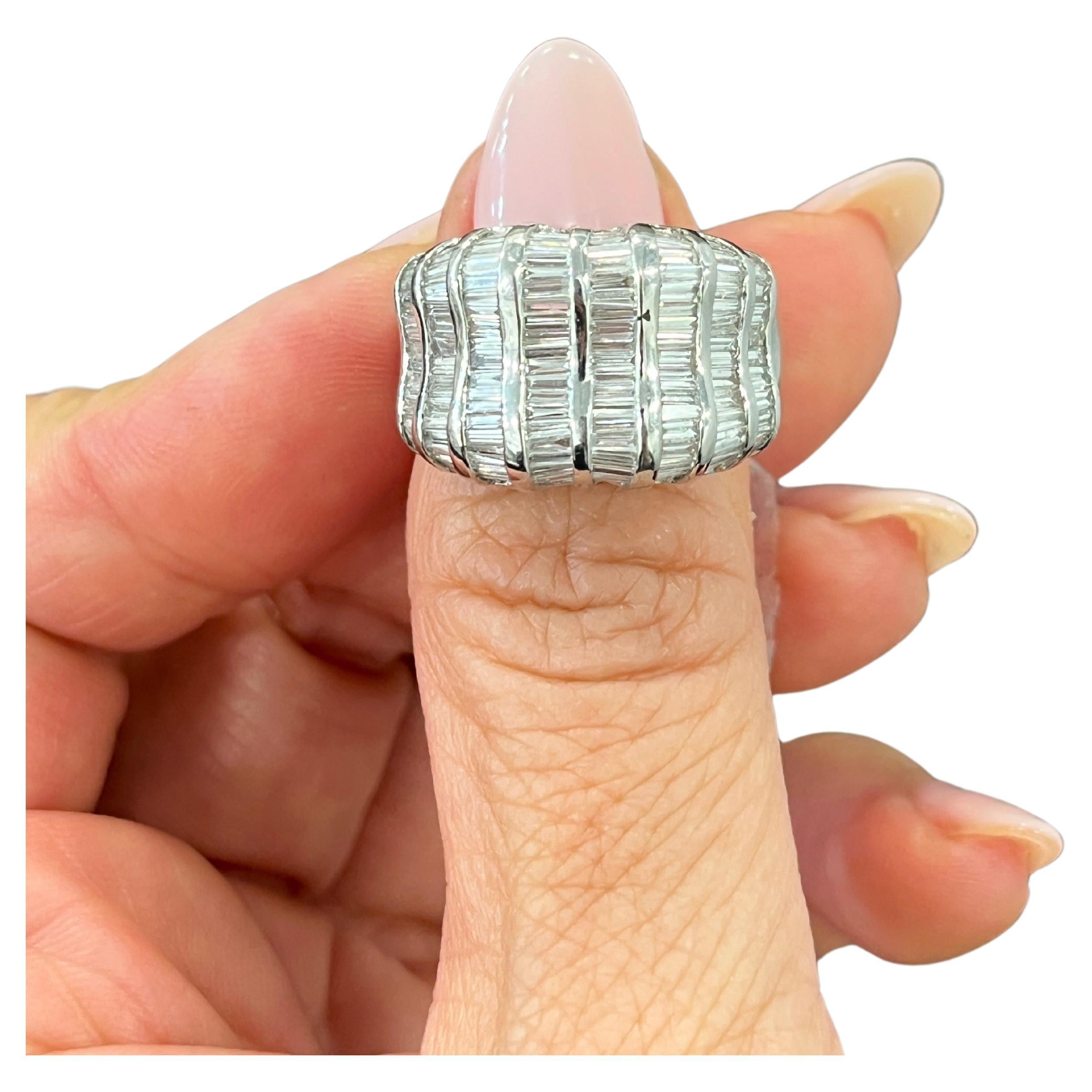 This exquisite ring is a stunning piece of fine jewelry that features a 3.48 carat baguette cut diamonds set in 18k white gold. The diamonds have a clarity grade of VS1/VS2 and a color grade of G/H, and is accented beautifully by the white gold