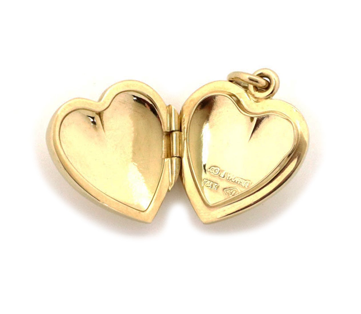This lovely authentic vintage locket pendant is crafted from 14k yellow gold with a polished finish featuring a double side frame heart shape hinged pendant with opens and has a snap shut clasp. Comes with an oval bail and it is signed by the