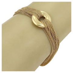 Bracelet Tiffany & Co. à fermoir à bascule, composé d'une chaîne à plusieurs rangs ornée de breloques circulaires en or jaune 18 carats, 8"