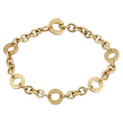 Bracciale Bvlgari con catena in oro giallo 18k con ciondoli a forma di cerchio incisi, 6,25"