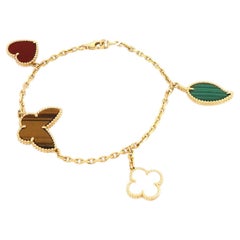 Van Cleef & Arpels Lucky Alhambra Armband aus 18 Karat Gelbgold mit 4 Motiven, mit Begleitpapier, 7,5"