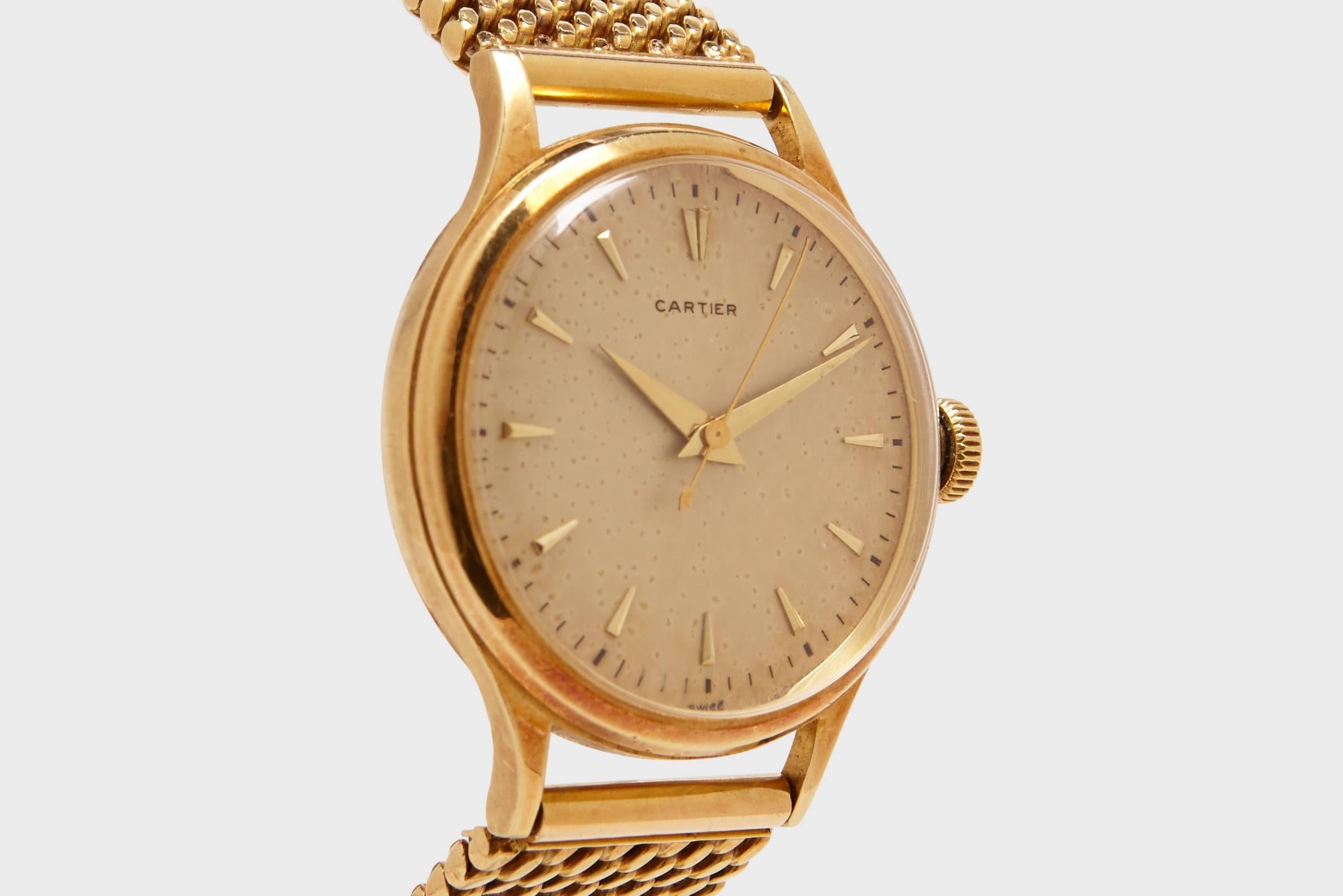 A solid eighteen carat gold Cartier mens dress watch on a Cartier solid eighteen carat gold mesh band. This is an exceptional quality, superb condition watch that is extremely rare watch. 

This Cartier is a classic, elegant watch design that
