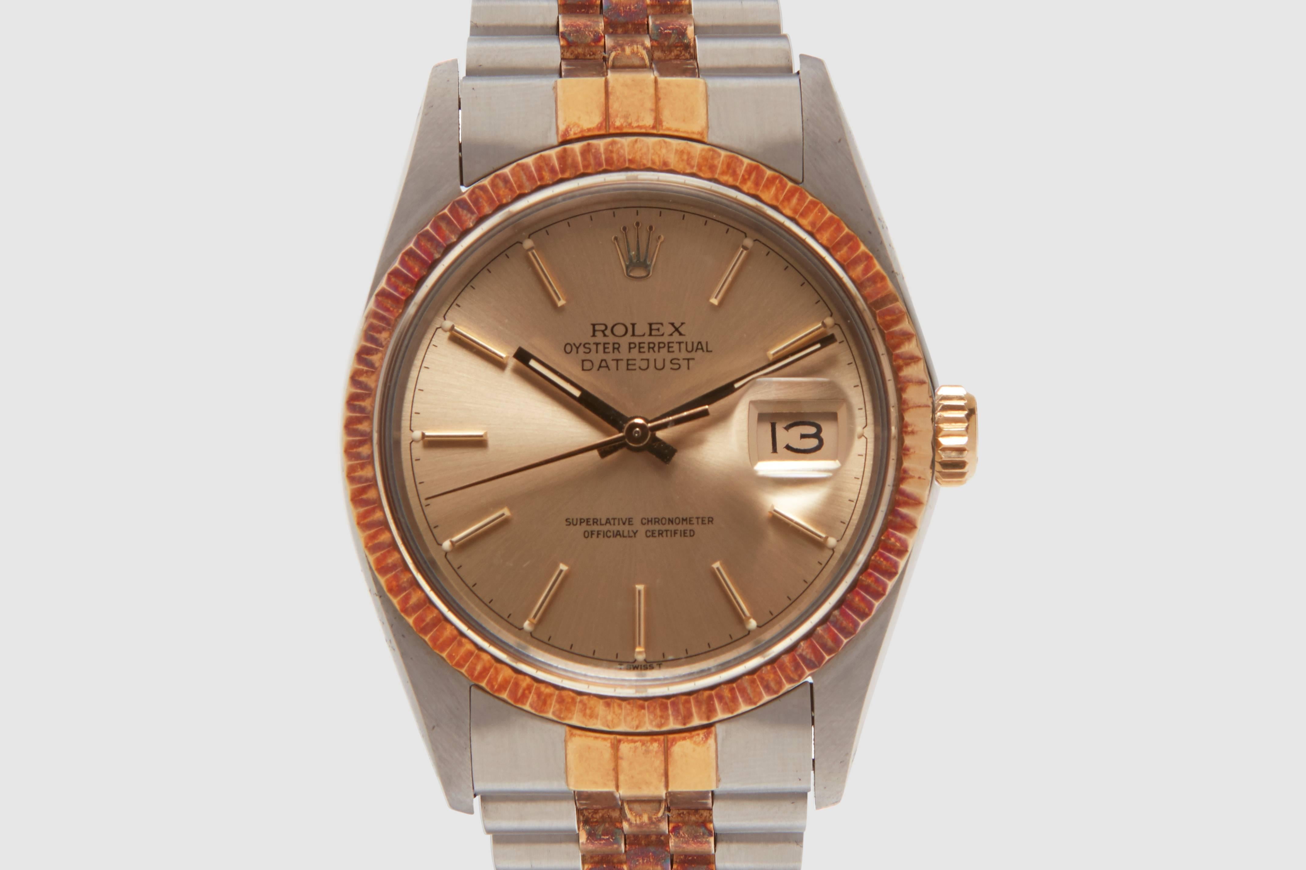 A stainless steel and eighteen carat gold Rolex Oyster Perpetual Datejust reference 16013. The watch is powered by a Rolex, Swiss made, twenty seven jewel automatic calibre 3035 movement that powered all of the acrylic crystal Datejust quick set