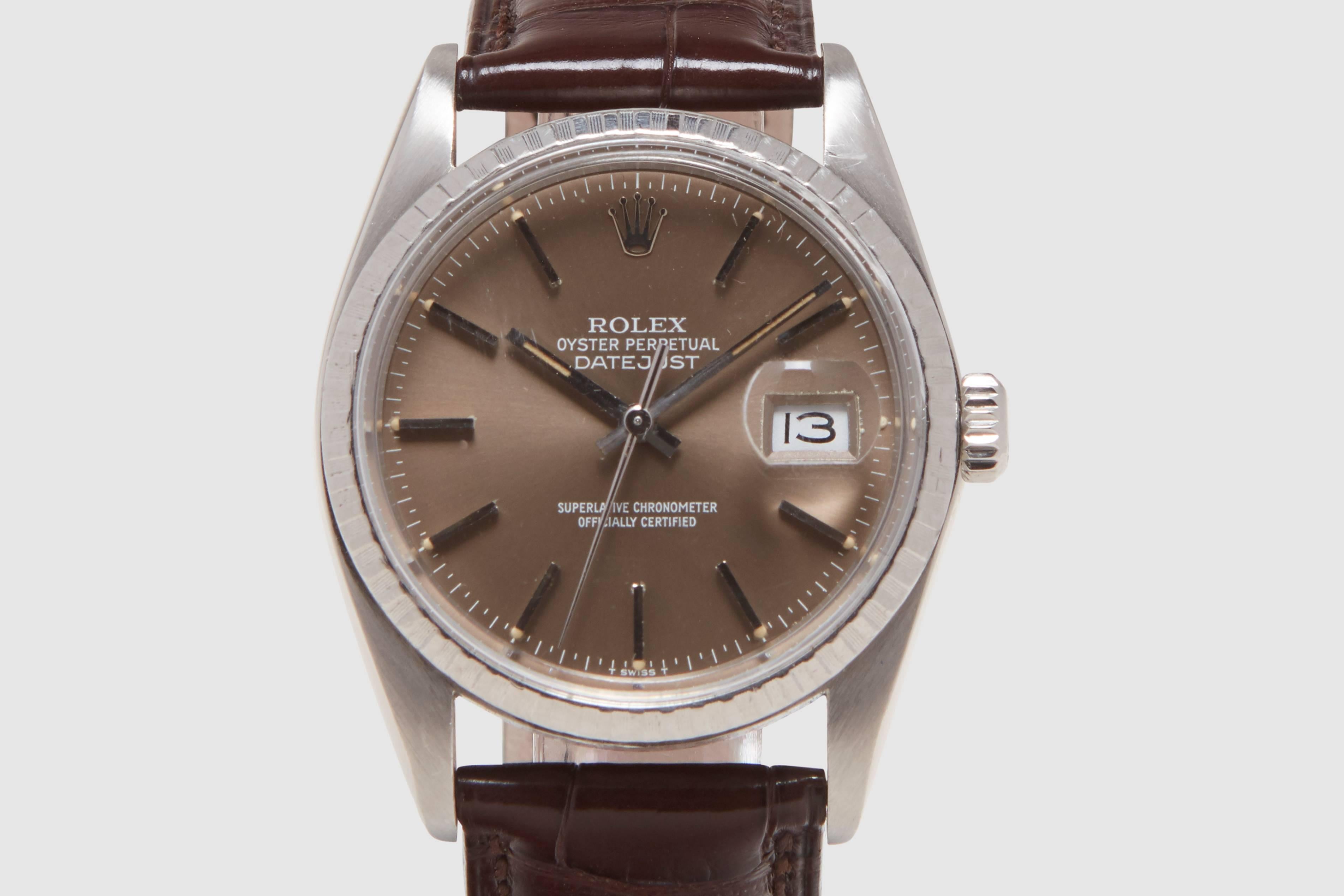 An unusual automatic stainless steel Rolex Oyster Perpetual Datejust reference 16030 model. This example has a gorgeous bronze dial with white gold stick markers. The writing and minute track are all printed in white, which pops cleanly off the