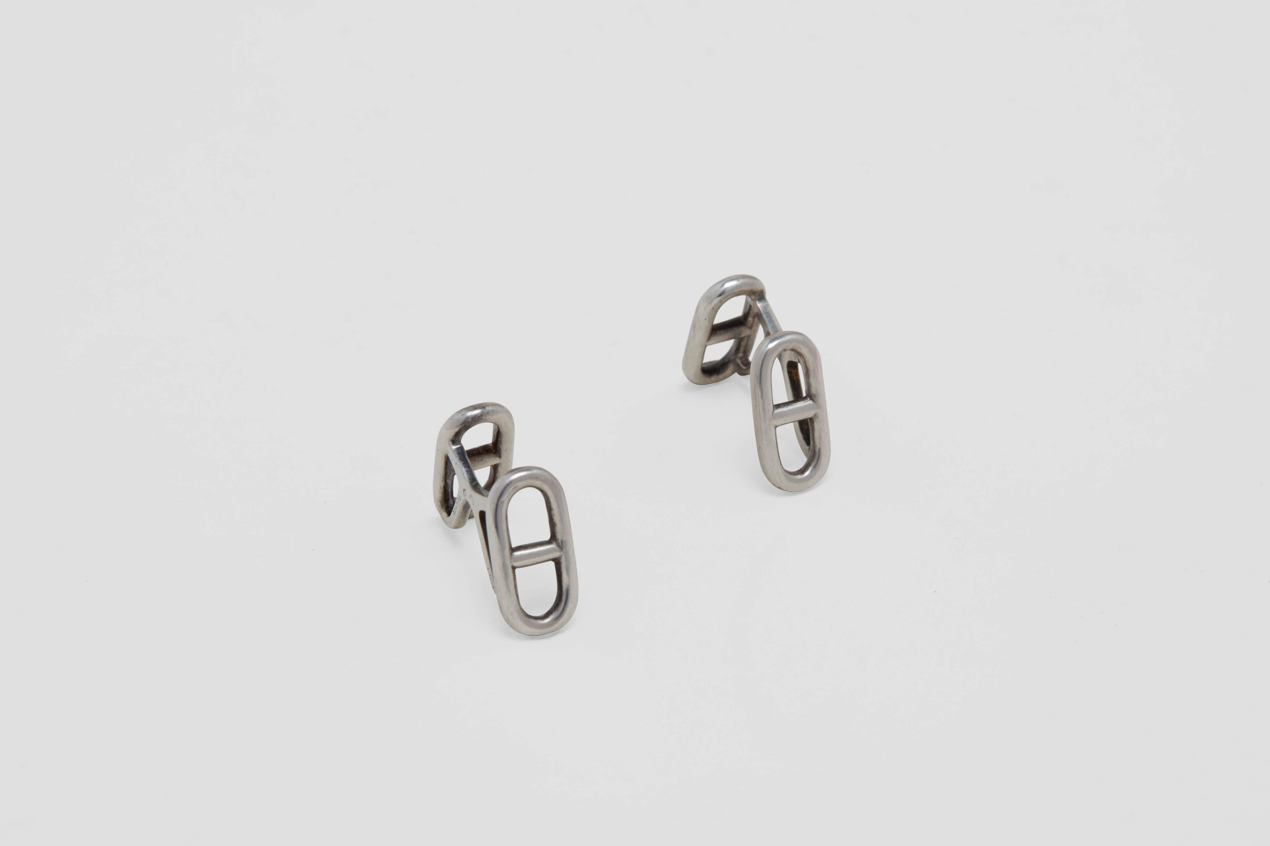 A pair of sterling silver cufflinks made in the form of a classic nautical anchor chain link design.  This exceptional, elegant and simple cufflink was made by the luxury retailer; Hermès.  This design, the 'chaine d'ancre' or 'anchor link chain' is