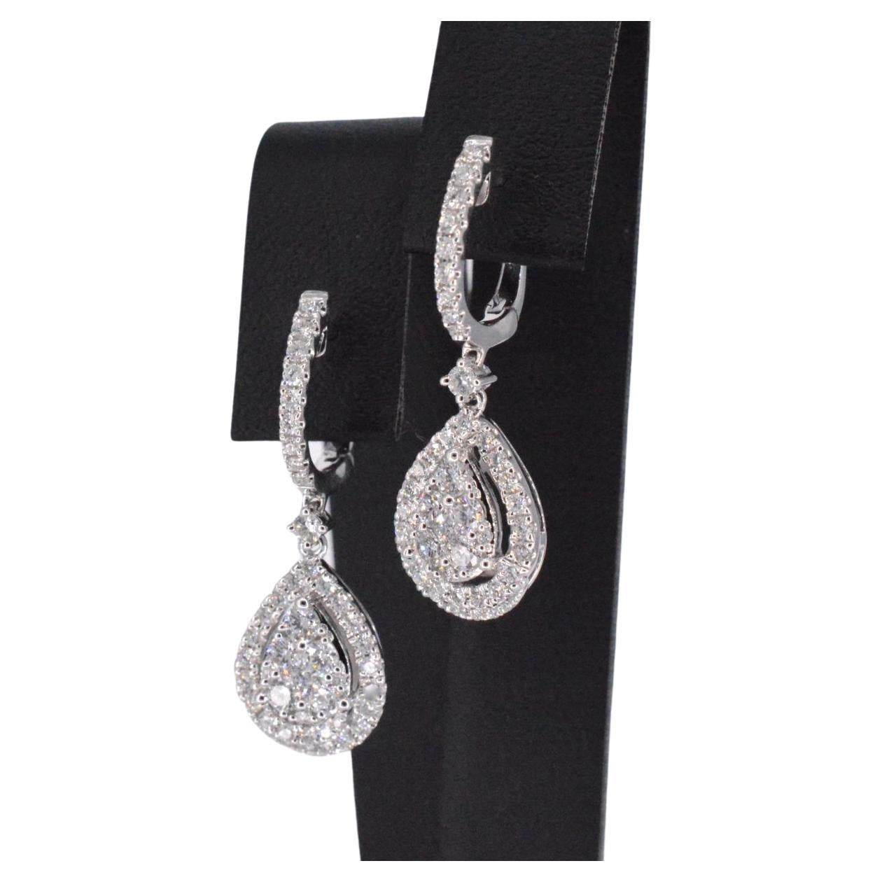 Introducing our exquisite drop-shaped earrings, fitted with stunningly brilliant cut diamonds that are naturally shiny. The diamonds have a combined weight of 1.50 carats, with a F-G color grade and VS clarity. Crafted from high-quality 18K gold