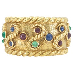 Bracelet manchette vintage David Webb des années 1970, en or et orné de multiples pierres précieuses
