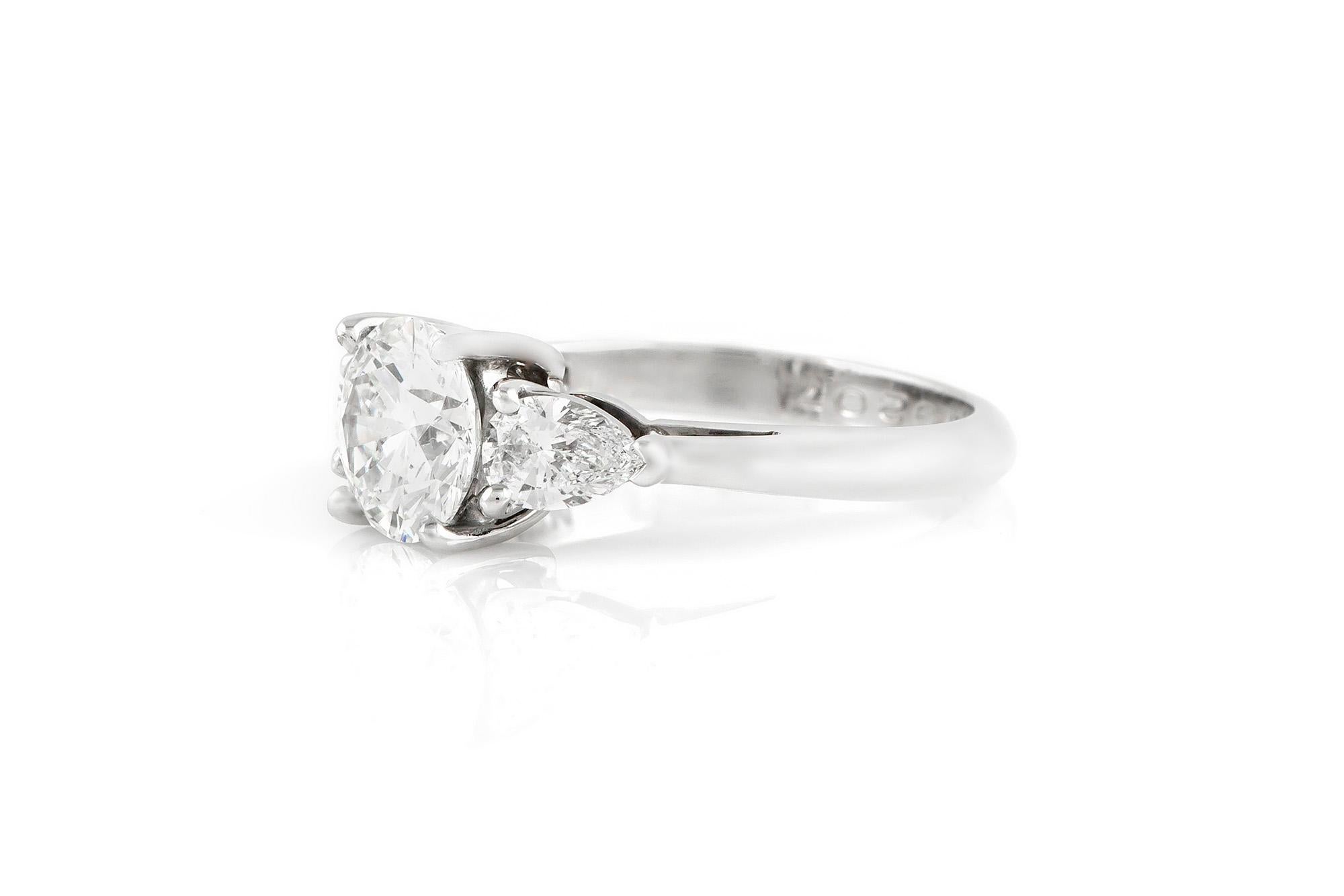 Signed Tiffany & Co. engagement ring finely crafted in platinum. Round brilliant cut diamond E color VS1 clarity, weighing a total of 1.50 carat. 