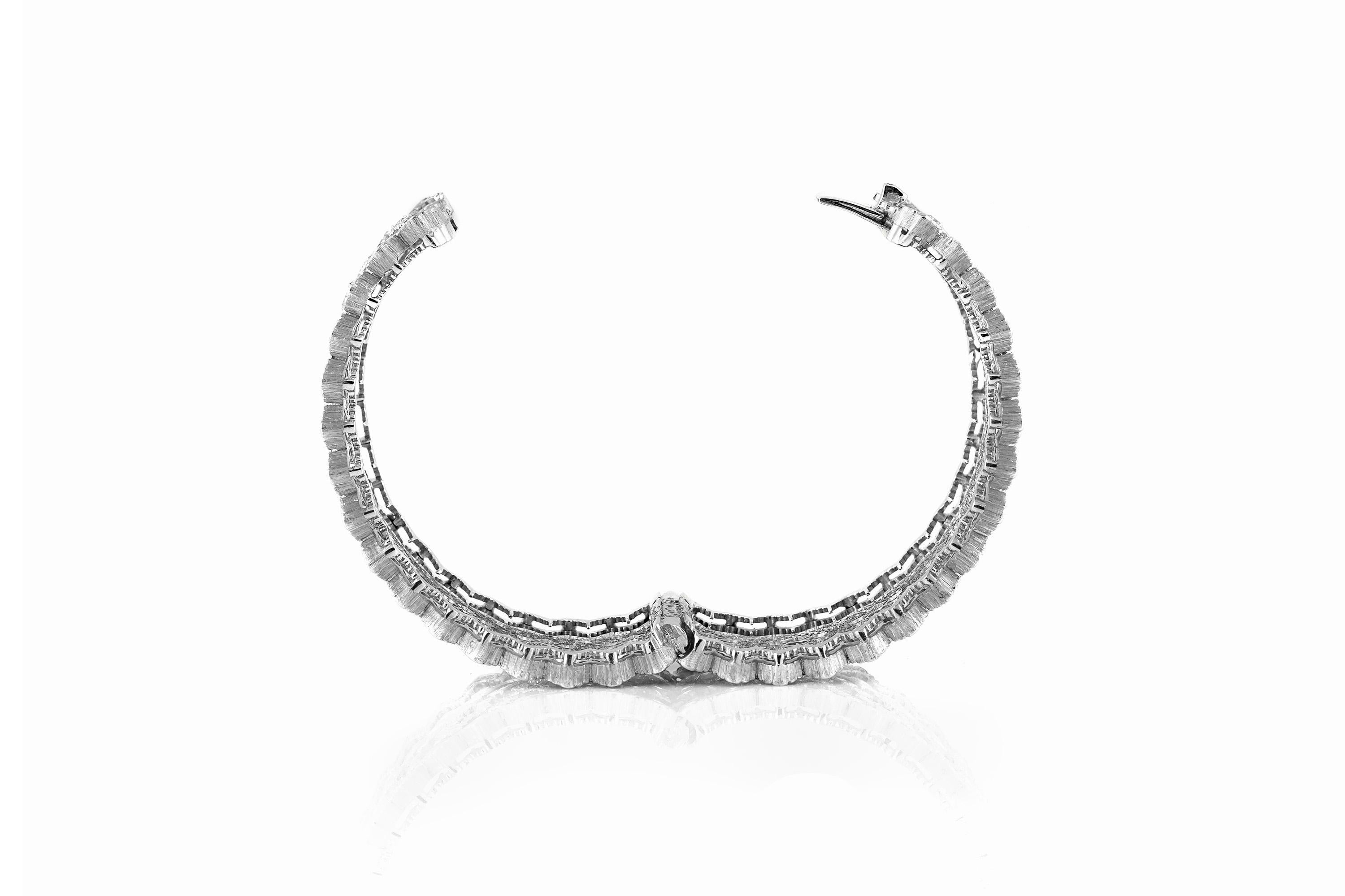 Cuff bracelet, finely crafted in 18k white gold and brilliant cut white diamonds. Clasp cuff enclosure bracelet.
Signed by Buccellati.  For additional information, images, or videos, please inquire within.