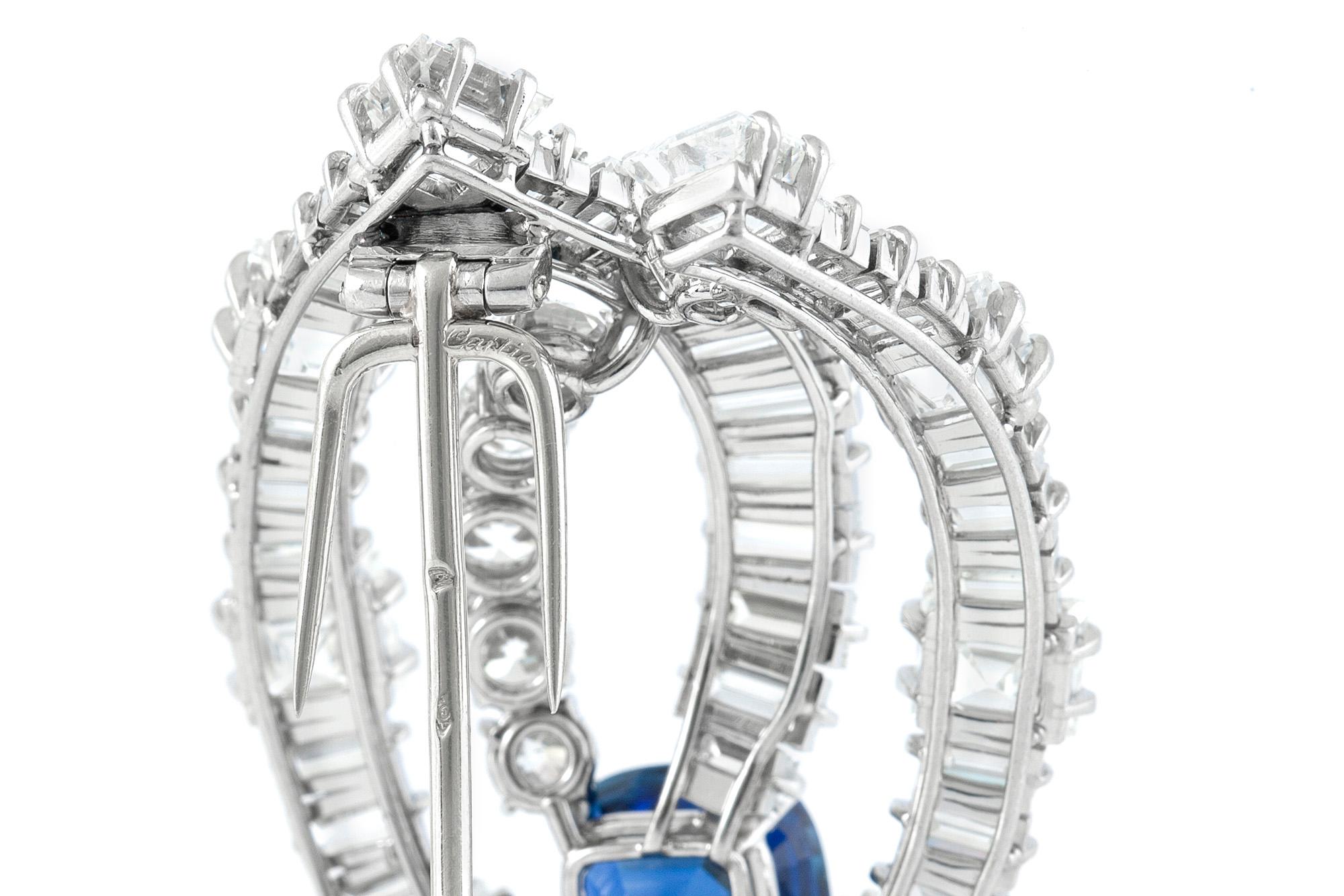 Exquisite Cartier Brooch from 1950's, finely crafted in platinum with natural, cushion cut, Burmese sapphire weighing 7.64 carat with no indications of heat treatment. The center Sapphire is surrounded by baguette, square and round brilliant cut