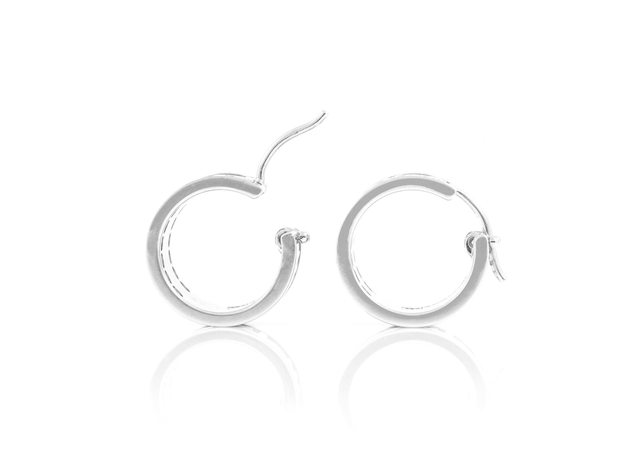 Tiffany & Co. Atlas earrings with diamonds finely crafted in 18k white gold. 