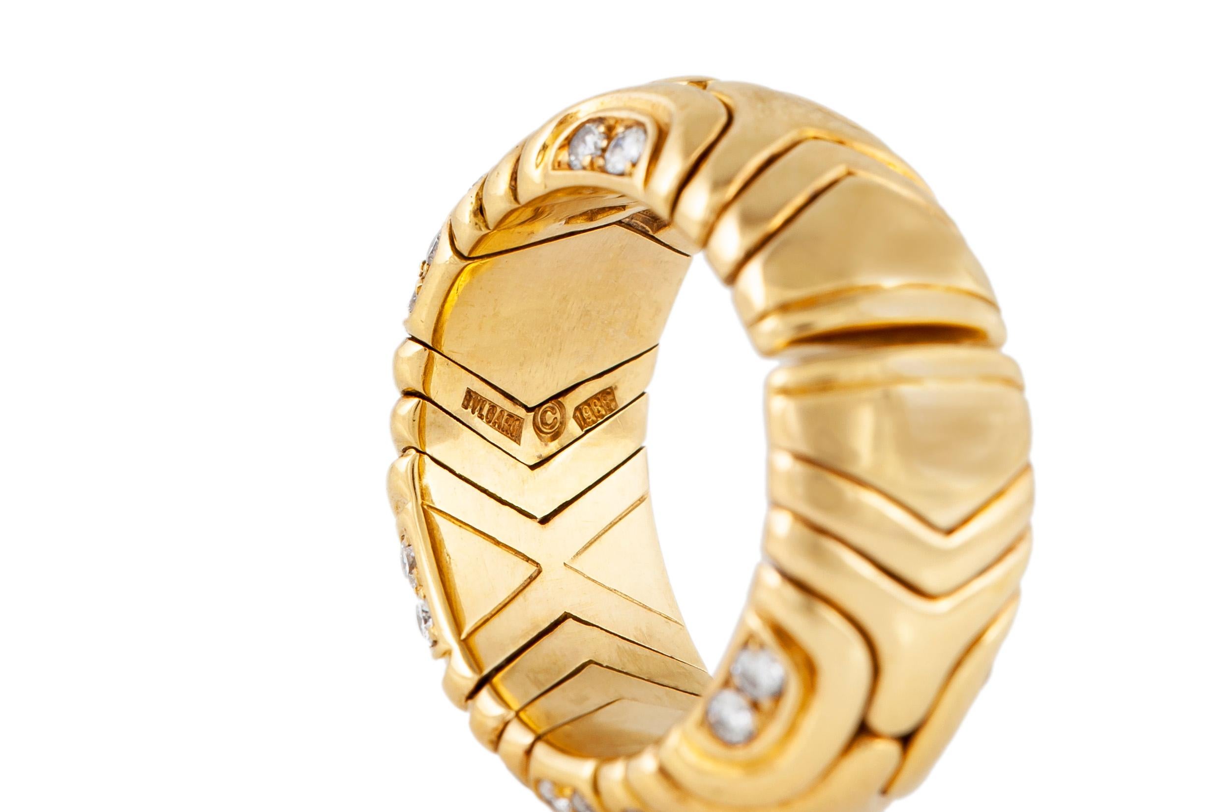 Original Bvlgari band, finely crafted in 18 k rose gold incrusted with brilliant cut diamonds. 