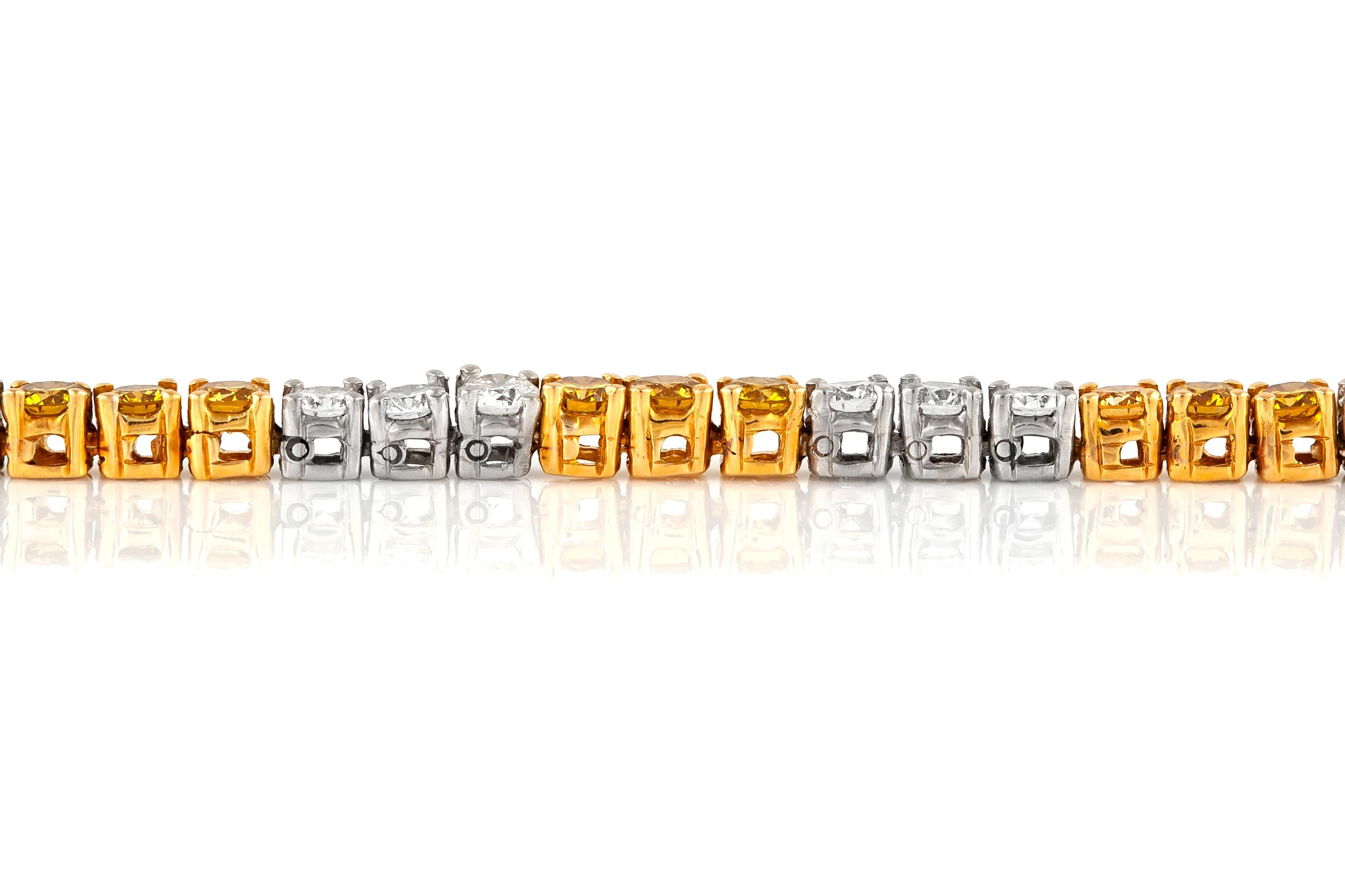 Tennis bracelet, finely crafted in 18k yellow and white gold with brillant cut, natural fancy yellow and white diamonds, weighing a total of 6.43 carat.
Signed and numbered by Oscar Heyman, 1986