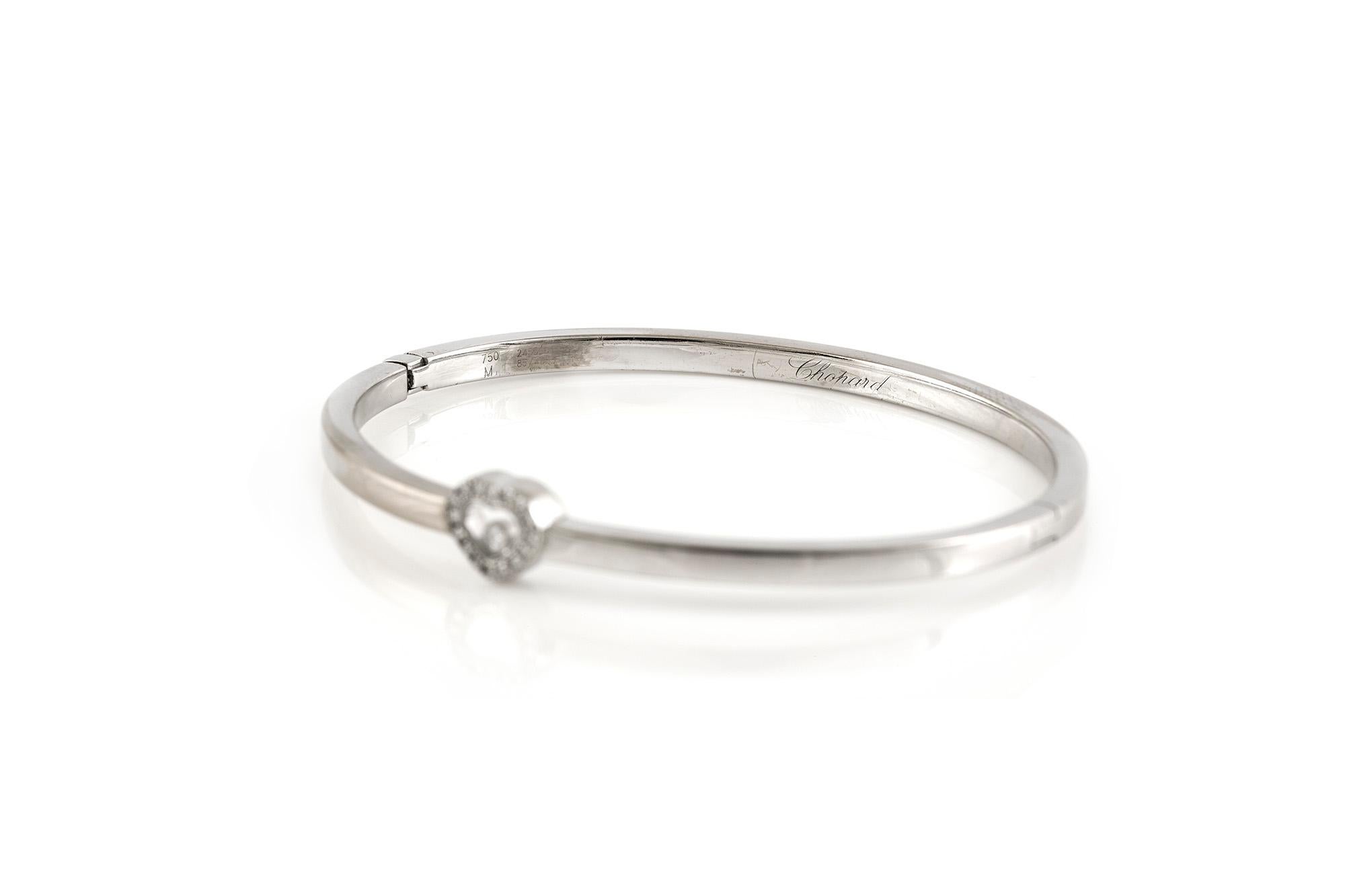 Chopard Happy Heart Bangle, finely crafted in 18 k white gold with diamonds weighing 0.37 carat.