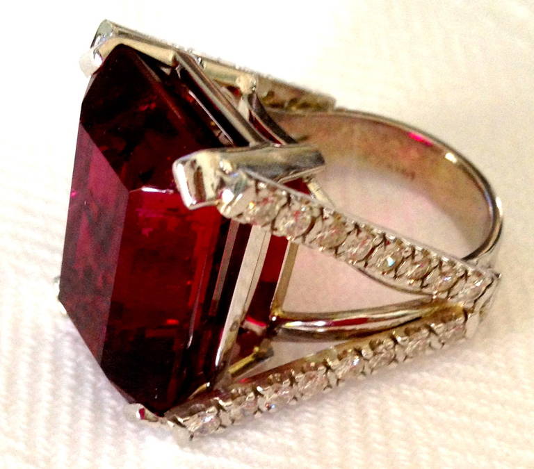 A beautiful, emerald-cut rubellite tourmaline displaying a rich, well-saturated magenta red color and fine luster.  Emerald-cuts are infrequently used for tourmaline and the selection of this style underscores the confidence of the cutter in the