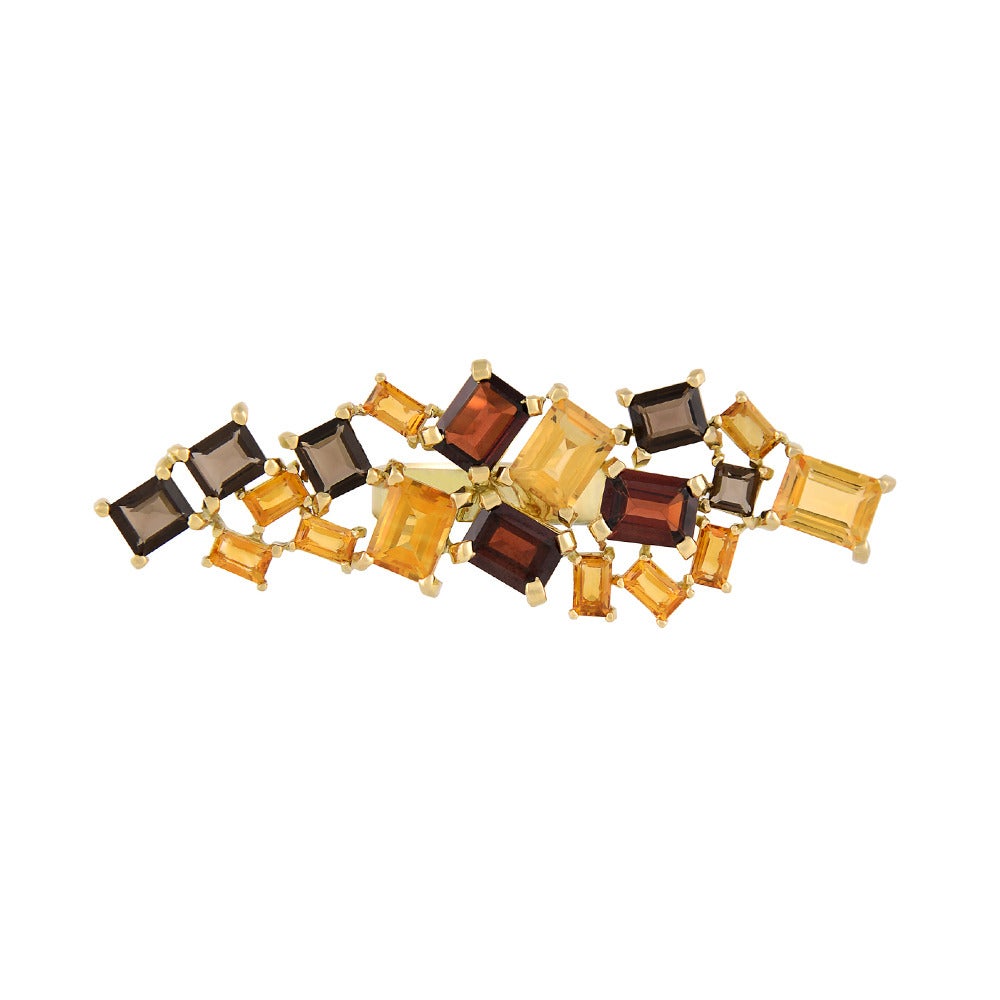 18ct yellow gold, citrine, garnet and smokey quartz ring 
One-of-a-kind
UK size O // Can be re-sized to any finger size.

Hand crafted in 18ct gold, the Shanghai Fire Ring is a mesmerising pave-work of citrine, garnet and smoky quartz baguettes.