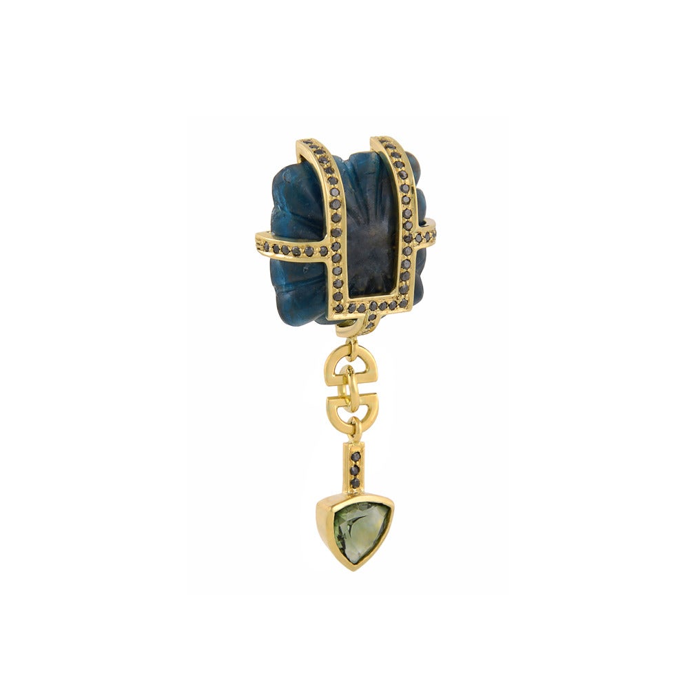 18ct yellow gold, kyanite, black diamond and green tourmaline earrings
One-of-a-kind
Hallmarked

The exquisite Concubine Earrings have featured in a wide variety of high fashion publications, from the Financial Times’ How to Spend It to Country &