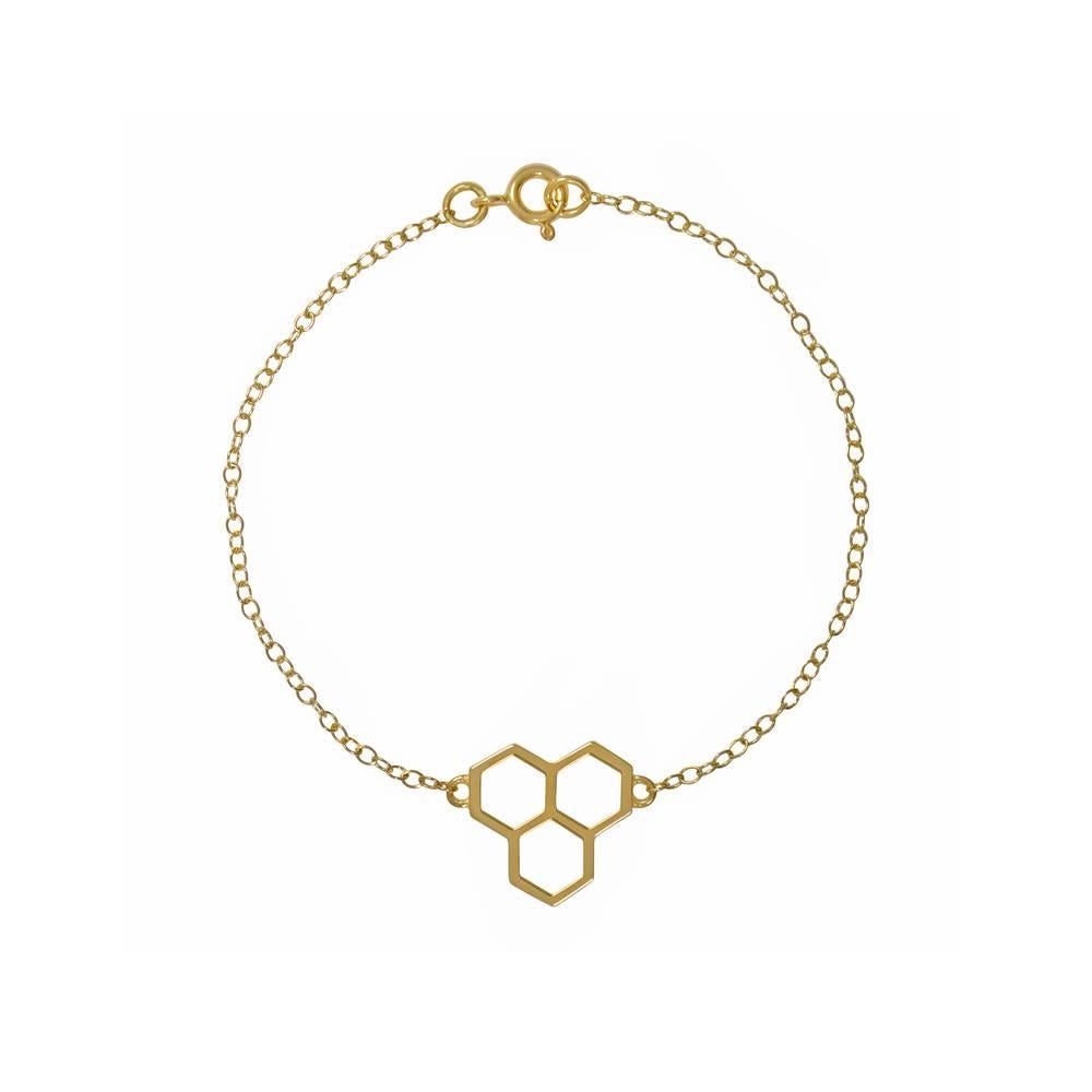 18ct yellow gold bracelet with honeycomb detail
One-of-a-kind
Hallmarked

This delicate bracelet is inspired by the natural geometry of the honeycomb. It is what Tessa would call an ‘everyday luxe piece’ – a design that can be worn all day, day