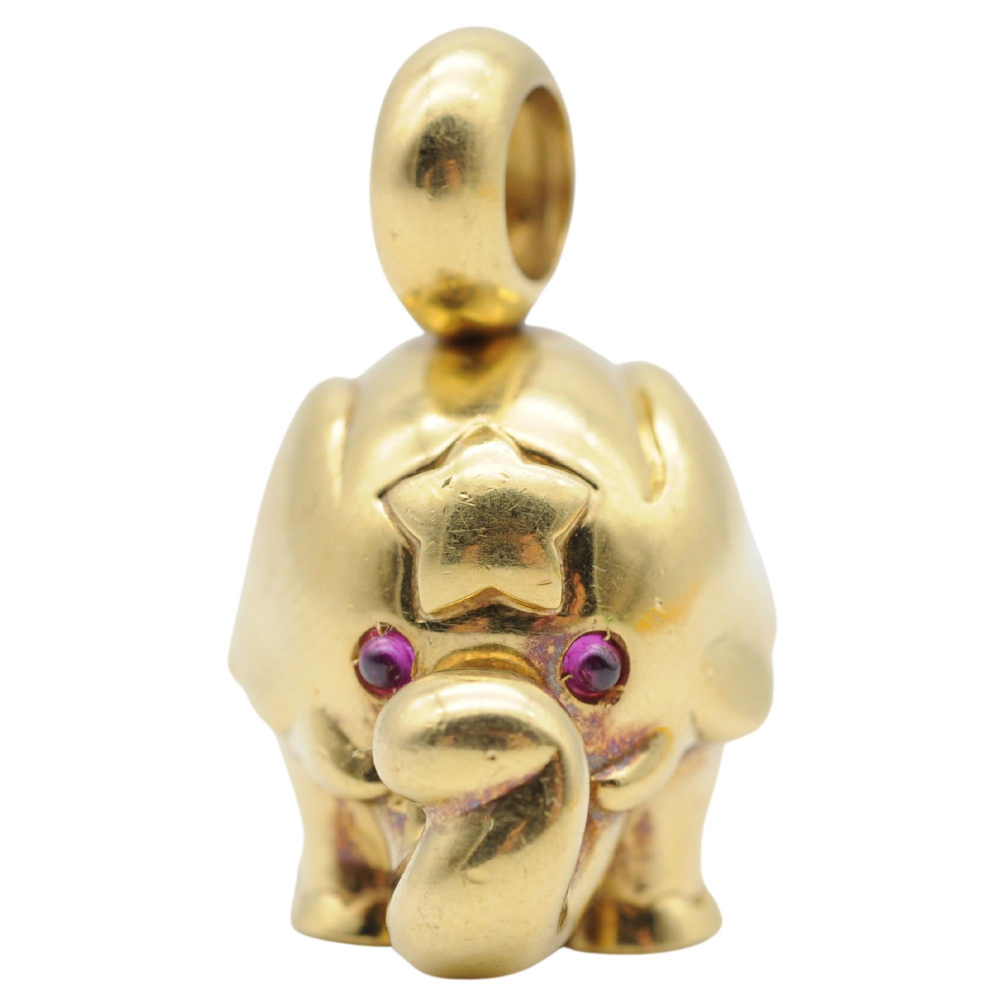 Behold the majestic Fancy Solid Elephant Pendant in 18k Yellow Gold with Ruby. This piece of jewelry is not just a pendant, but a masterpiece that captures the essence of elegance, grace, and power. Expertly crafted in solid 18k yellow gold, this
