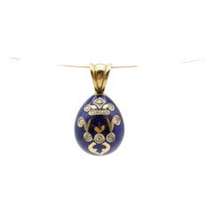 Unique egg pendant with diamonds, 18K yellow gold