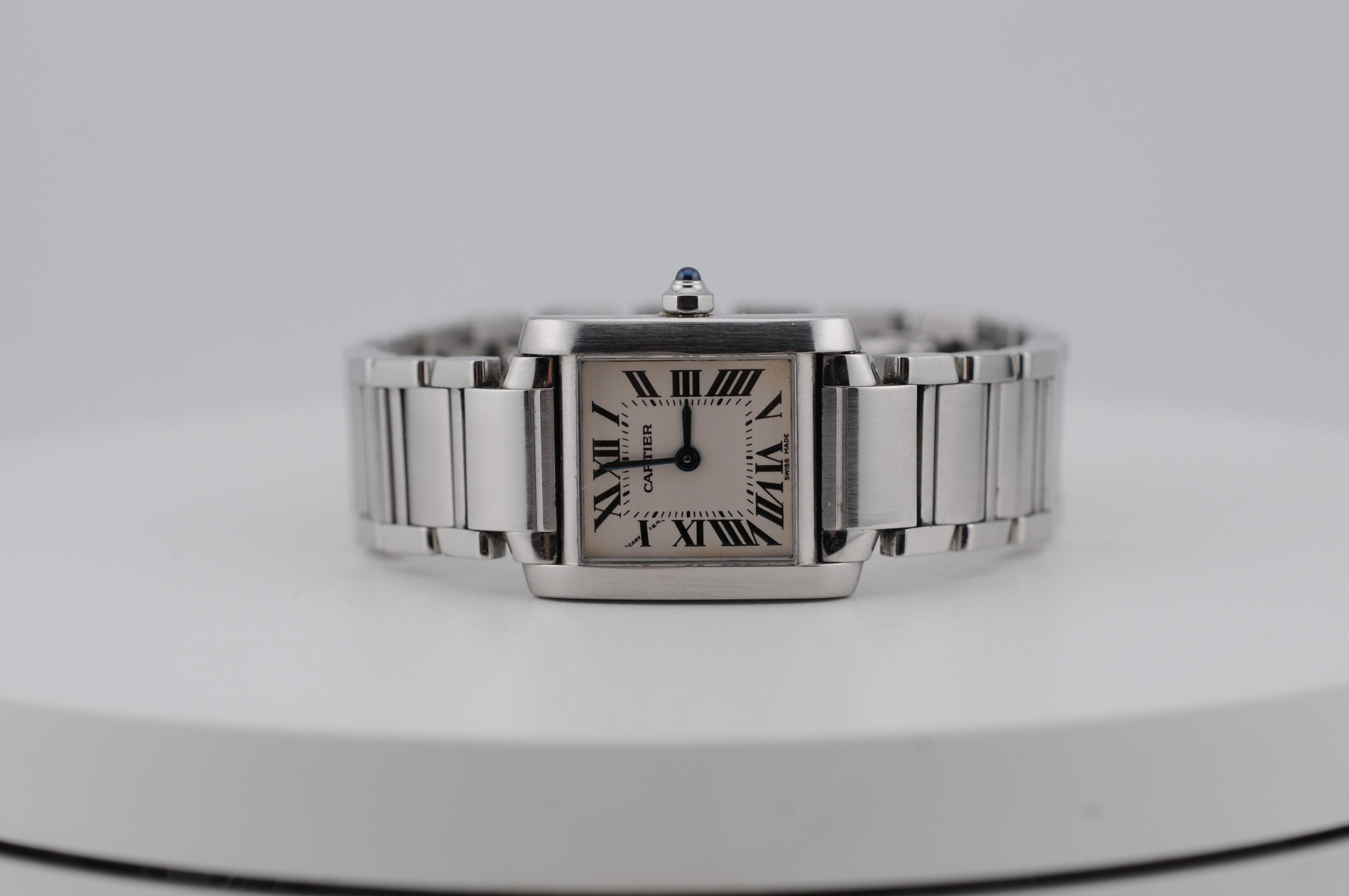 A timeless Cartier Tank Française reference 2384, crafted in stainless steel with a precise quartz movement. Dated to 2001, this classic model features Cartier’s signature Roman numerals and a polished case. No box or papers included. A refined