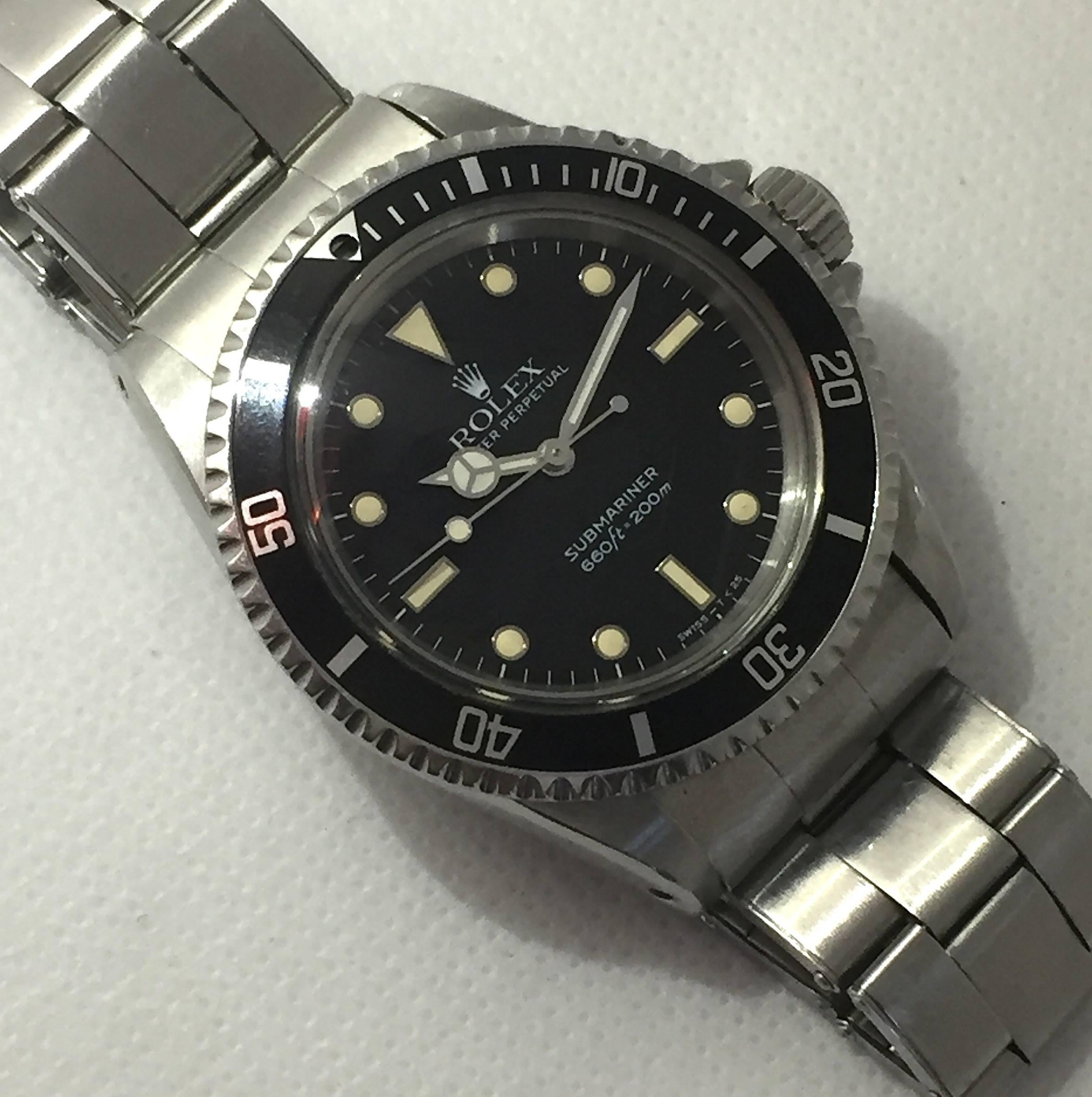 Rolex Stainless Steel Oyster Perpetual Submariner Wristwatch
Reference 5513
Factory Black Gloss Dial (Service Dial) with Applied Hour Markers with Metal Surrounds and Matching Hands.
Black Rotating Bezel (Pearl Missing)
40mm in size 
Rolex Calibre