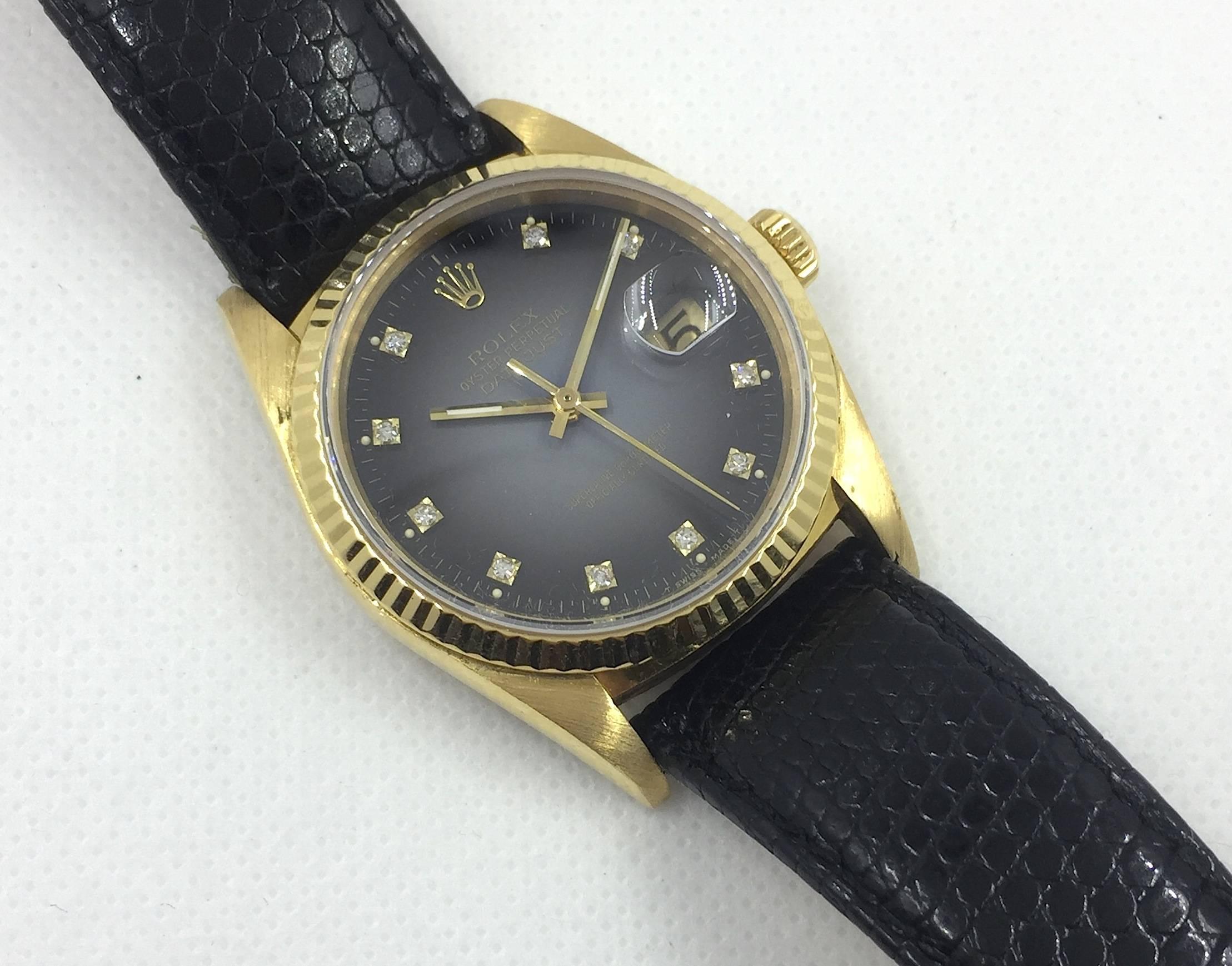Rolex 18K Yellow Gold Oyster Perpetual Datejust Wristwatch
Rare Factory Grey Vignette Degrade Diamond Dial
18K Yellow Gold Fluted Bezel
36mm in size 
Rolex Calibre Base 3000 Automatic Movement
Sapphire Crystal
1980's Production
Comes Fitted on