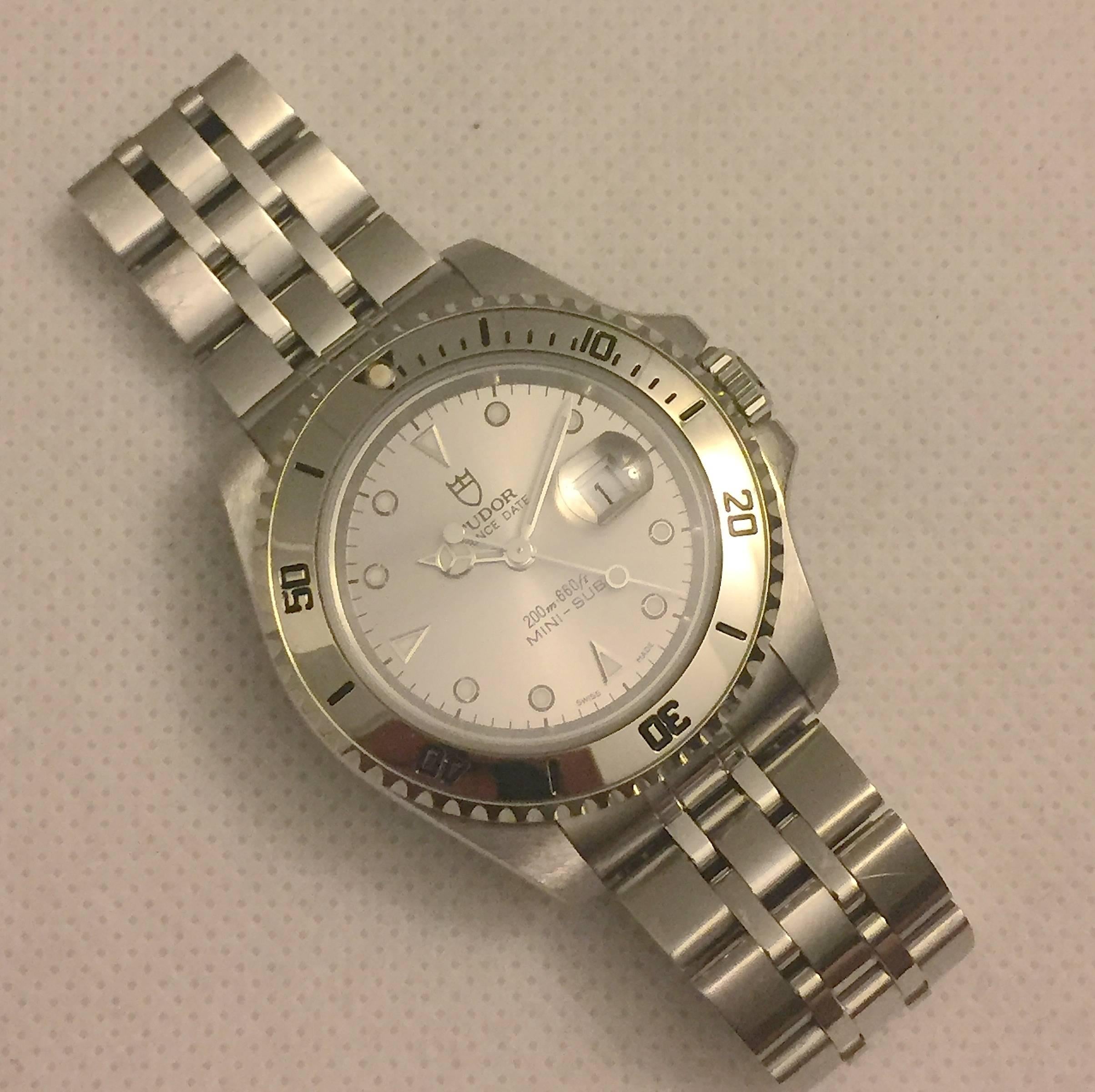 Tudor Prince Stainless Steel Mini Sub Automatic Wristwatch
Factory Metallic Silvered Dial with Applied Hour Markers
Uni-Directional Rotating Bezel
34mm in size 
Tudor Automatic Movement
Sapphire Crystal
Late 1990's Production
Fits Up To A 5.5