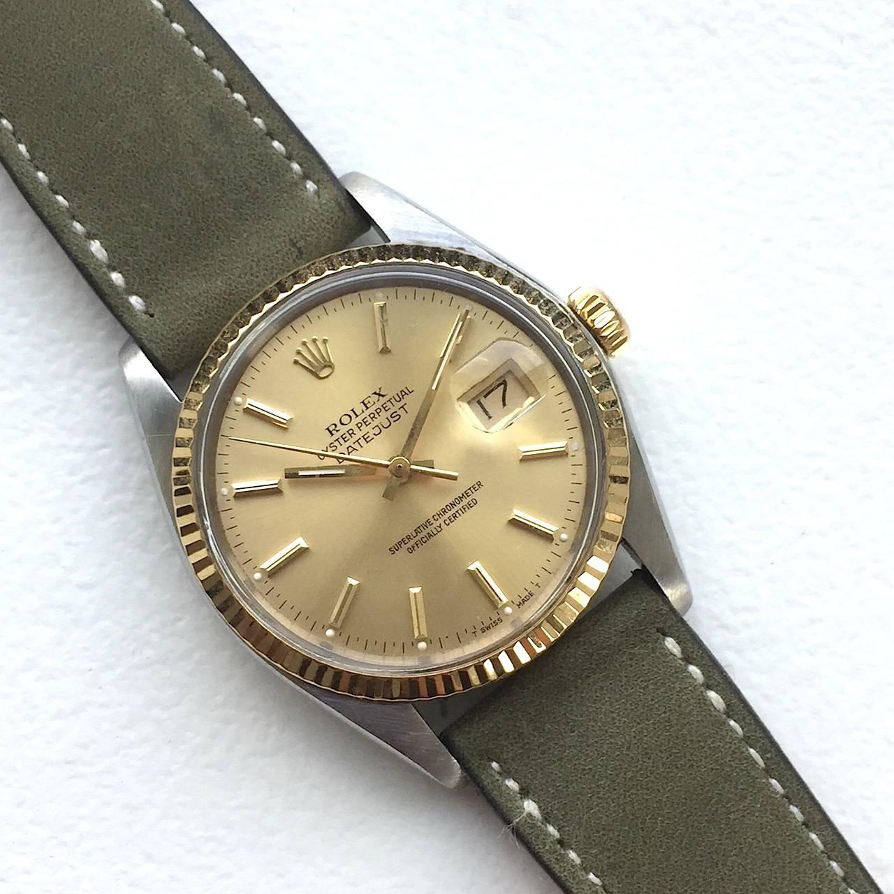 Rolex Stainless Steel and Yellow Gold Oyster Perpetual Datejust Watch
Beautiful Factory Champagne Dial with Yellow Applied Hour Markers
Yellow Gold Gold Fluted Bezel
Stainless Steel Case
36mm in size 
Features Rolex Automatic Movement Calibre 3035