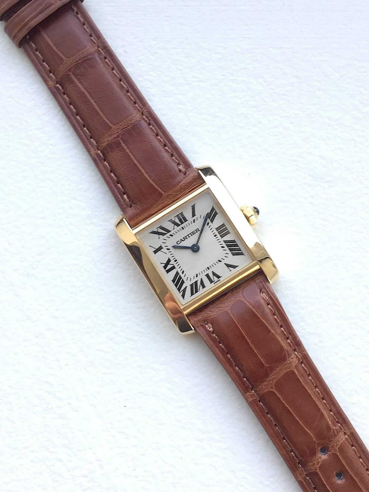 Cartier 18K Yellow Gold Tank Francaise Watch 
Classic Cartier Tank Design with Roman Numeral Markers 
White Colored Dial with Cartier Hands 
Medium Size
25mm x 30mm Case Cartier Cabochon Crown
Sapphire Crystal 
Quartz Movement 
Comes Fitted on A