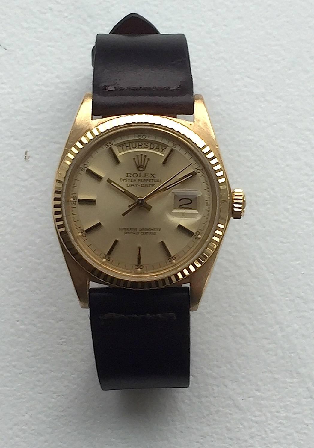 Rolex 18K Yellow Gold Day-Date Presidential Watch from the Early 1970's
Beautiful Factory Champagne Dial with Applied Yellow Hour Markers 
Yellow Gold Gold Fluted Bezel
18K Yellow Gold Case
36mm in size 
Features Rolex Automatic Movement with