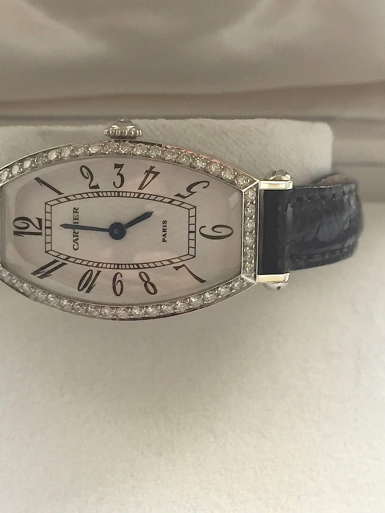 Cartier Paris Ladies 18K White Gold and Diamond Manual Wind Watch with Guilloche Dial
Case Shape: Tonneau
Case Material: 18K White Gold
Case Diameter: 21mm
Watch Length: 32mm
Watch Height: 8mm
Hand Style: Blued Steel
Numerical Style: Arabic
Dial