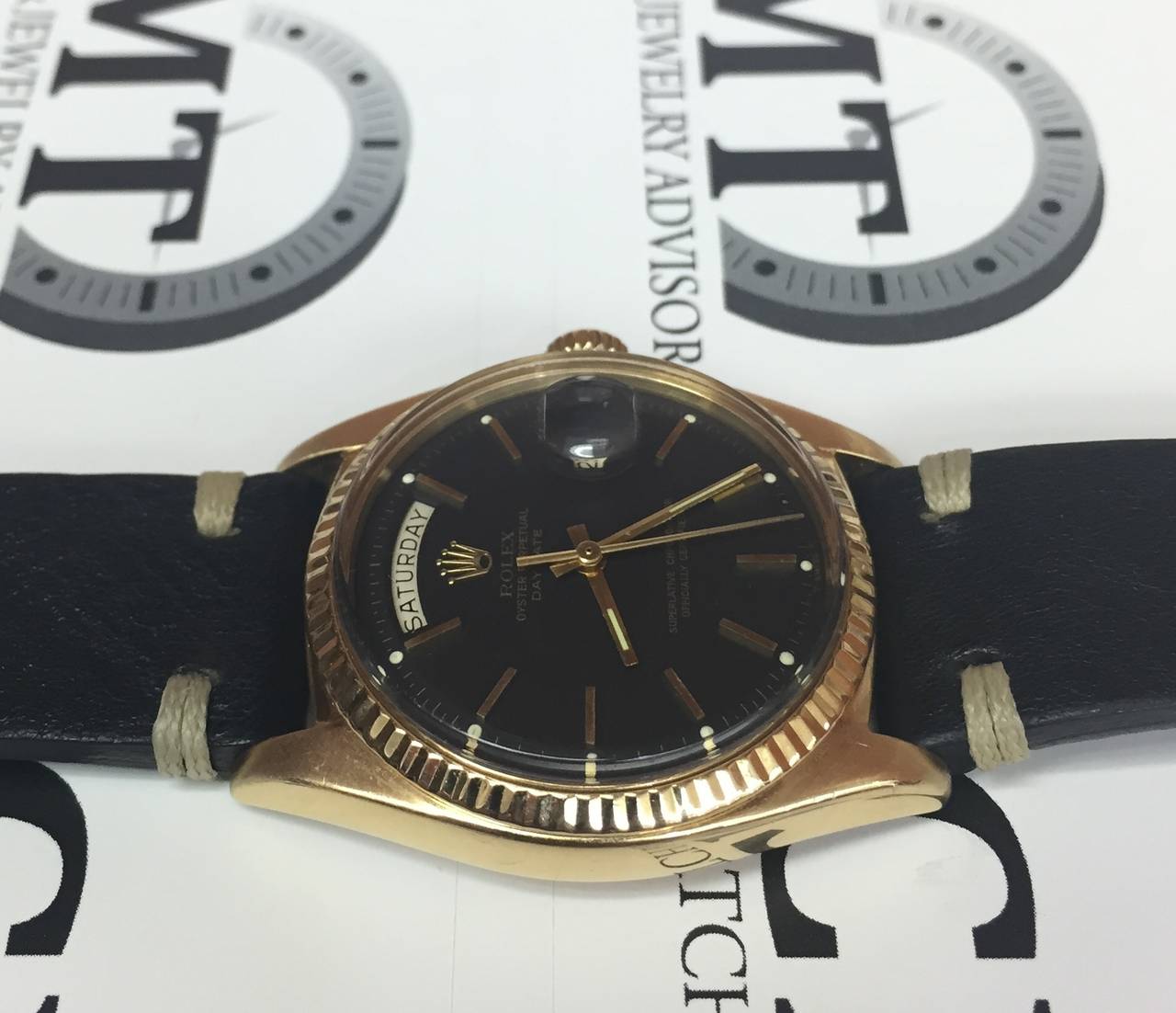 gold rolex black dial