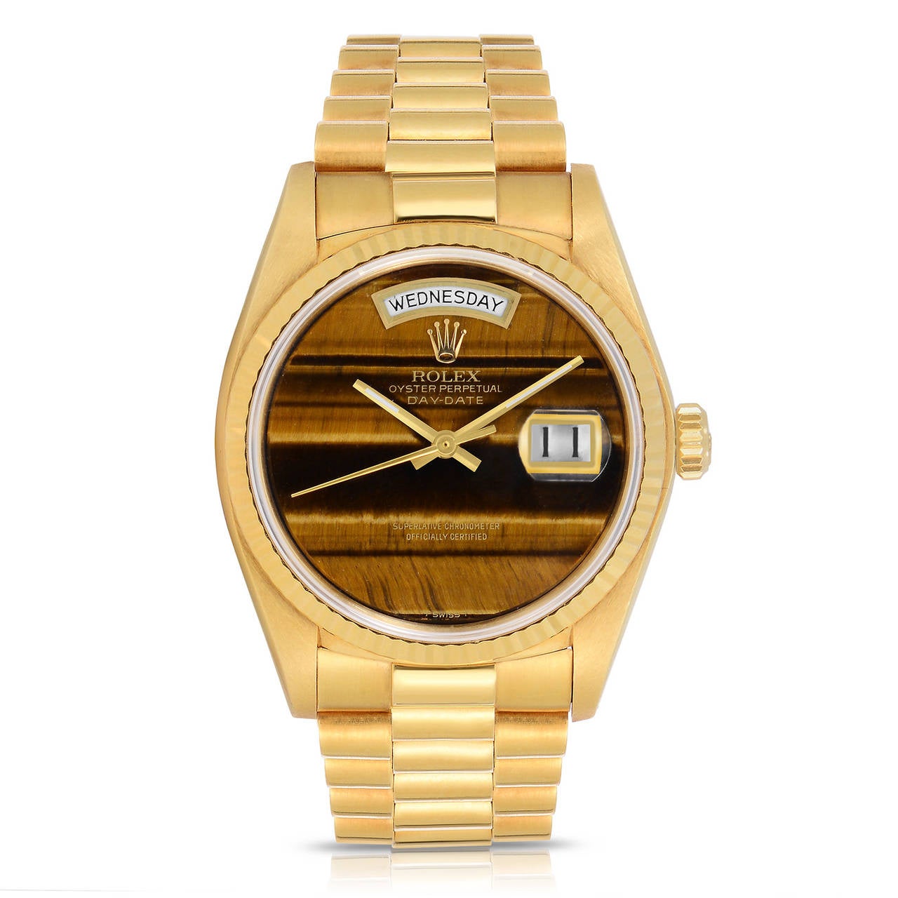 Rolex 18K Yellow Gold Day-Date President
Factory Tiger's Eye Quartz dial with beautiful banding
Solid 18K Yellow Gold Case
Unpolished Case
1980's
All Factory from Rolex
Comes with Original Paperwork and Hang-tag
